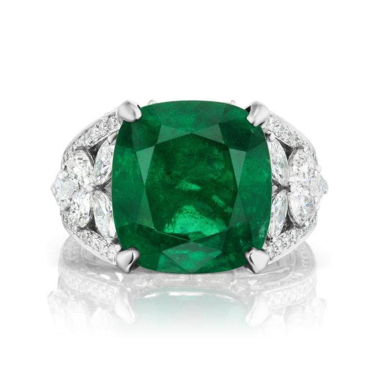 EMERALD AND DIAMOND RING A cluster of certified pear and marquis shaped diamonds forms a spectacular crown on top of which an extraordinary dark hued Emerald is perched. Item: # 03140 Metal: 18k W Lab: Grs Color Weight: 12.00 ct. Diamond Weight: