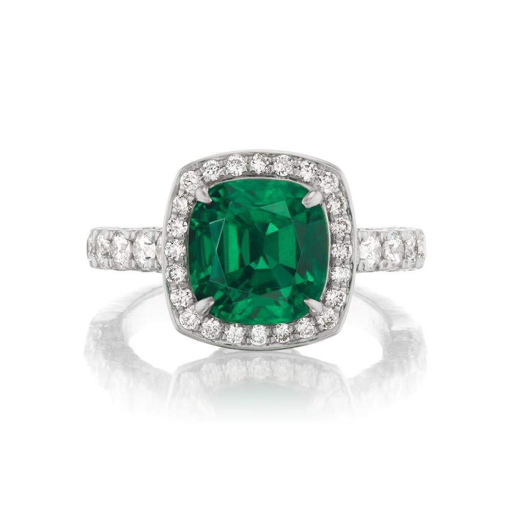 EMERALD AND DIAMOND RING
The claw-set cushion-cut Emerald sits beautifully on this stylish diamond
halo frame. The diamonds highlight its breathtaking green hue
Item: # 04009
Metal: 18k White Gold
Color Weight: 3.52 ct.
Diamond Weight: 1.60 ct.