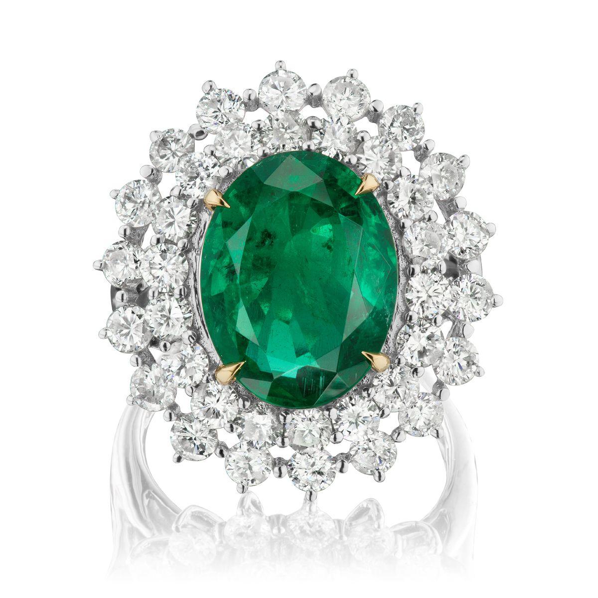 EMERALD AND DIAMOND RING
A rich 5 ct oval Emerald sits with round shaped diamonds in a
substantial white gold setting
Item: # 02418
Metal: 18k W
Color Weight: 5.27 ct.
Diamond Weight: 2.83 ct.