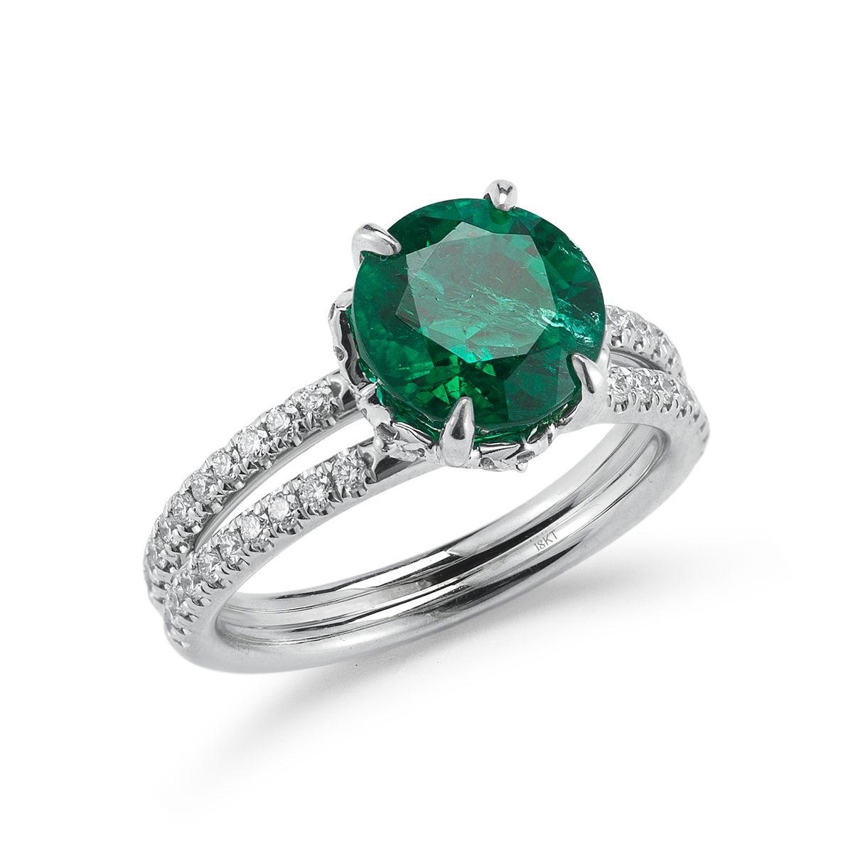 18k White Gold 2.92ct Emerald And .88ct Diamond Ring

A charming round emerald is nestled atop a lofted diamond basket with
a classic split micropavÃ© band.
Item: # 02557
Metal: 18k W
Lab: C.dunaigre
Color Weight: 2.92 ct.
Diamond Weight: 0.88 ct.