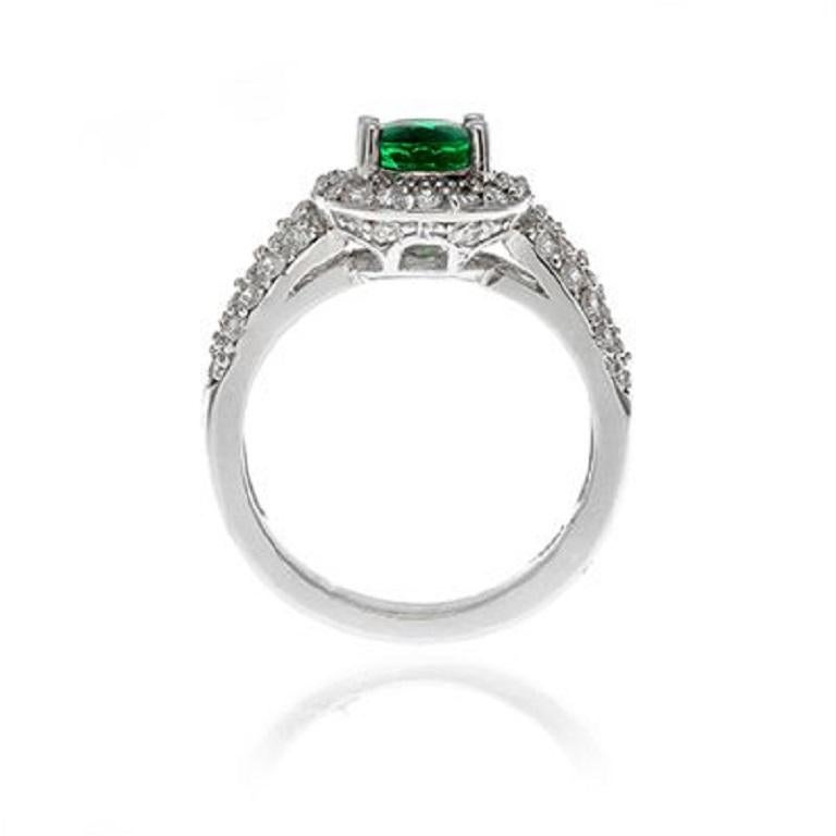 18k White Gold 1.15ct Emerald and .87ct Diamond Ring

A deep colored emerald is the feature of this classic diamond halo
setting.
Item: # 00903
Metal: 18k W
Color Weight: 1.15 ct.
Diamond Weight: 0.87 ct.