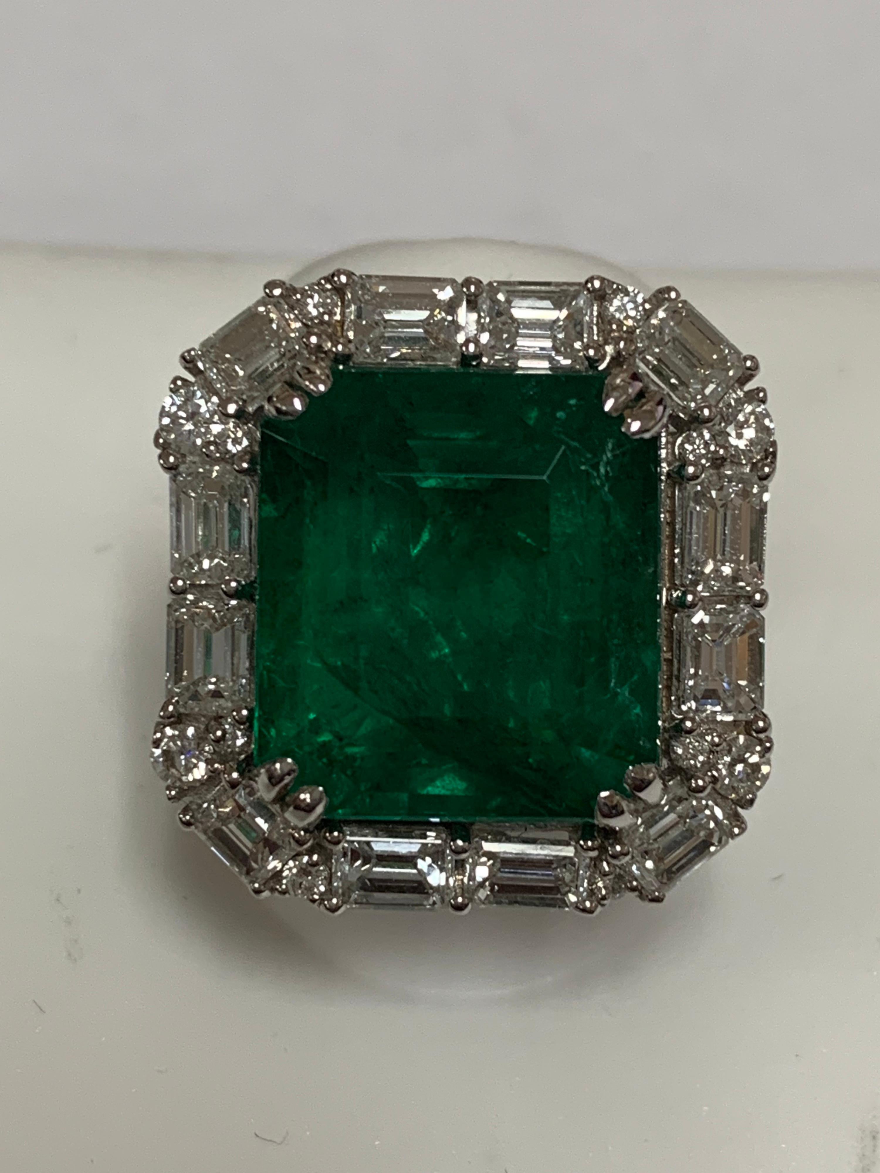 Natural Octagon 15.14 Carat emerald and 2.70 Carat White Diamonds set in 18 Karat gold is one of a kind handcrafted ring, The size of the ring is 7 but can be resized if needed.