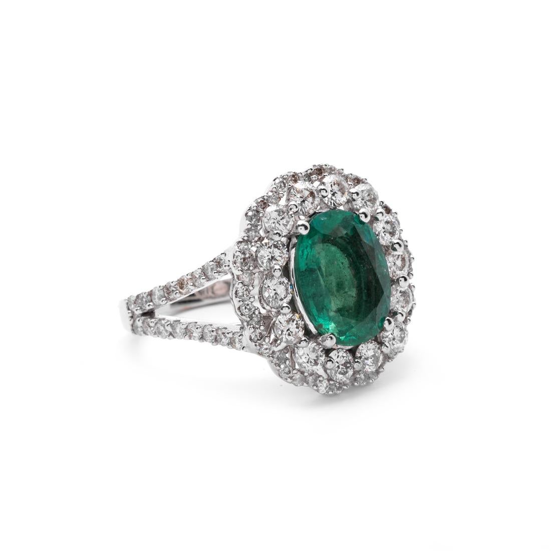 Emerald and Diamond Ring
Emerald weighing approx. 2.48 cts
Diamonds weighing approx 1.62 cts
mounted in 18kt gold
6.96 grams (gross)
Accompanied with AIG Appraisal 000717363018 
stating:
One 18Kt White Gold Emerald & Diamond Ring, featured emerald