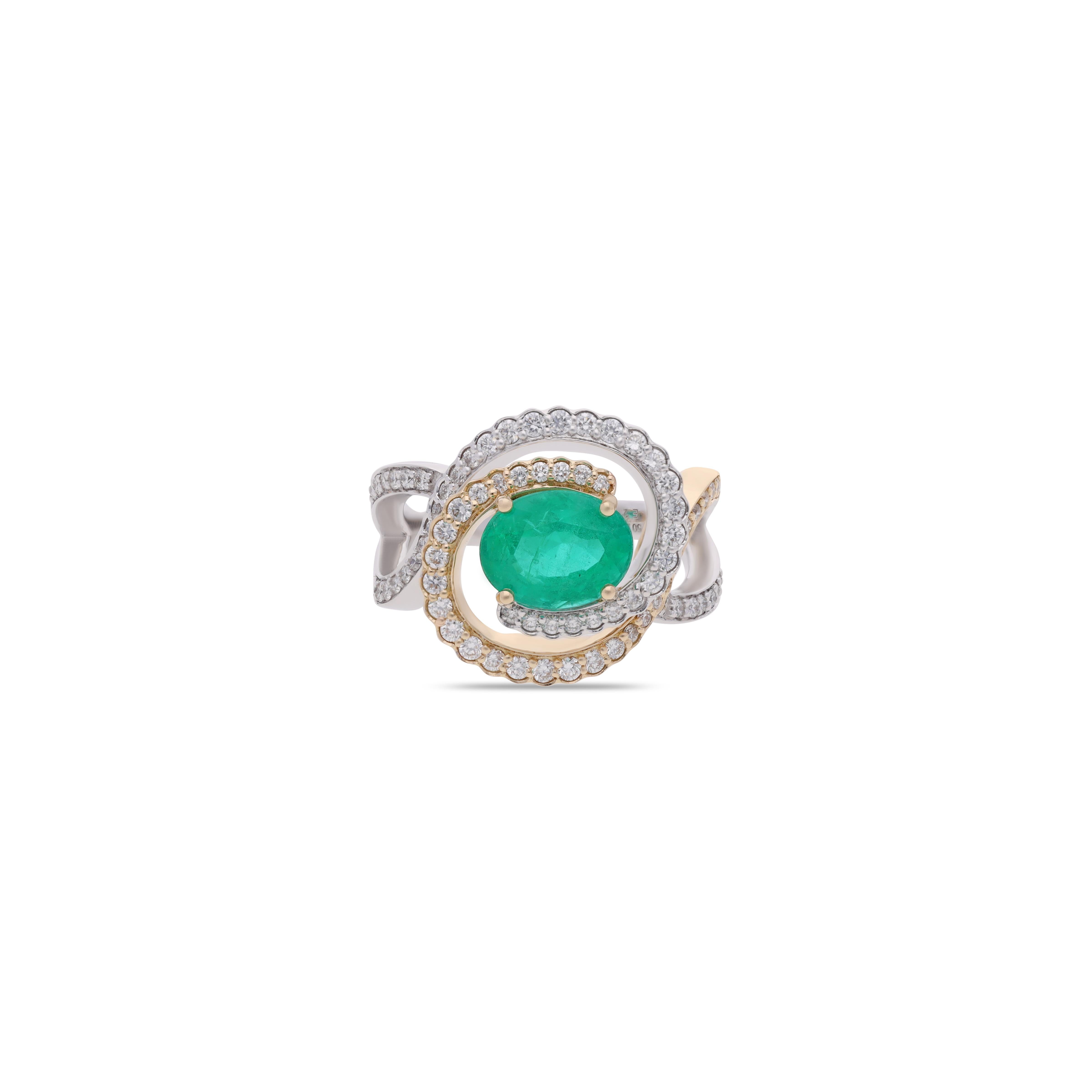 A captivating blend of elegance and sophistication, this exquisite ring features a vivid 2.04-carat emerald at its center. Surrounded by 76 dazzling diamonds totaling 0.69 carats, the design is beautifully crafted in 18KT yellow and white gold. The