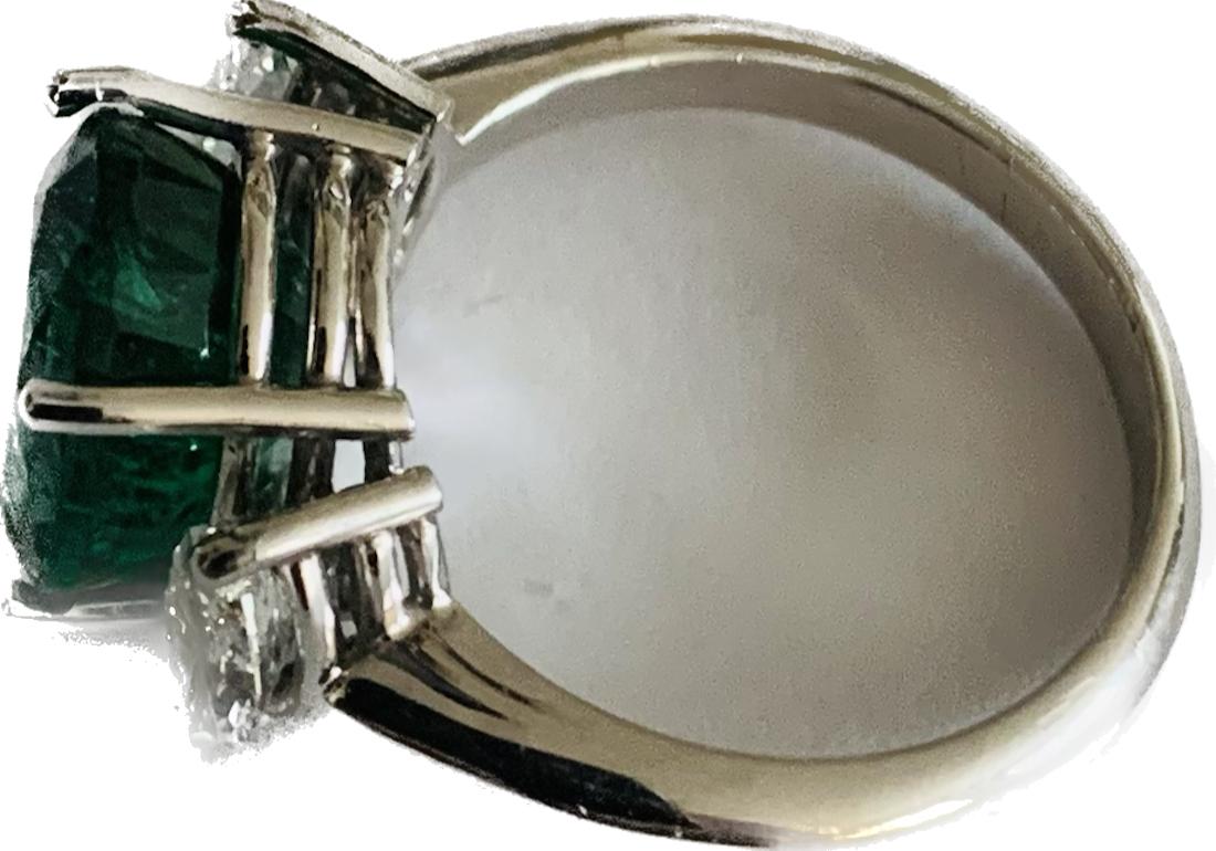 Ring with oval emerald of Zambian origin weighing 4.91ct and two marquis cut diamonds weighing 0.83ct. It is made in 18K white gold. HRD certificate is enclosed.

Product Details
↣ Jewelry Type - Rings
↣ Style - Classic
↣ Jewelry Main Material - 18K