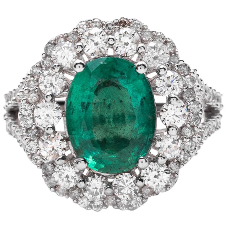 Superb sugarloaf emerald and diamond ring. at 1stDibs