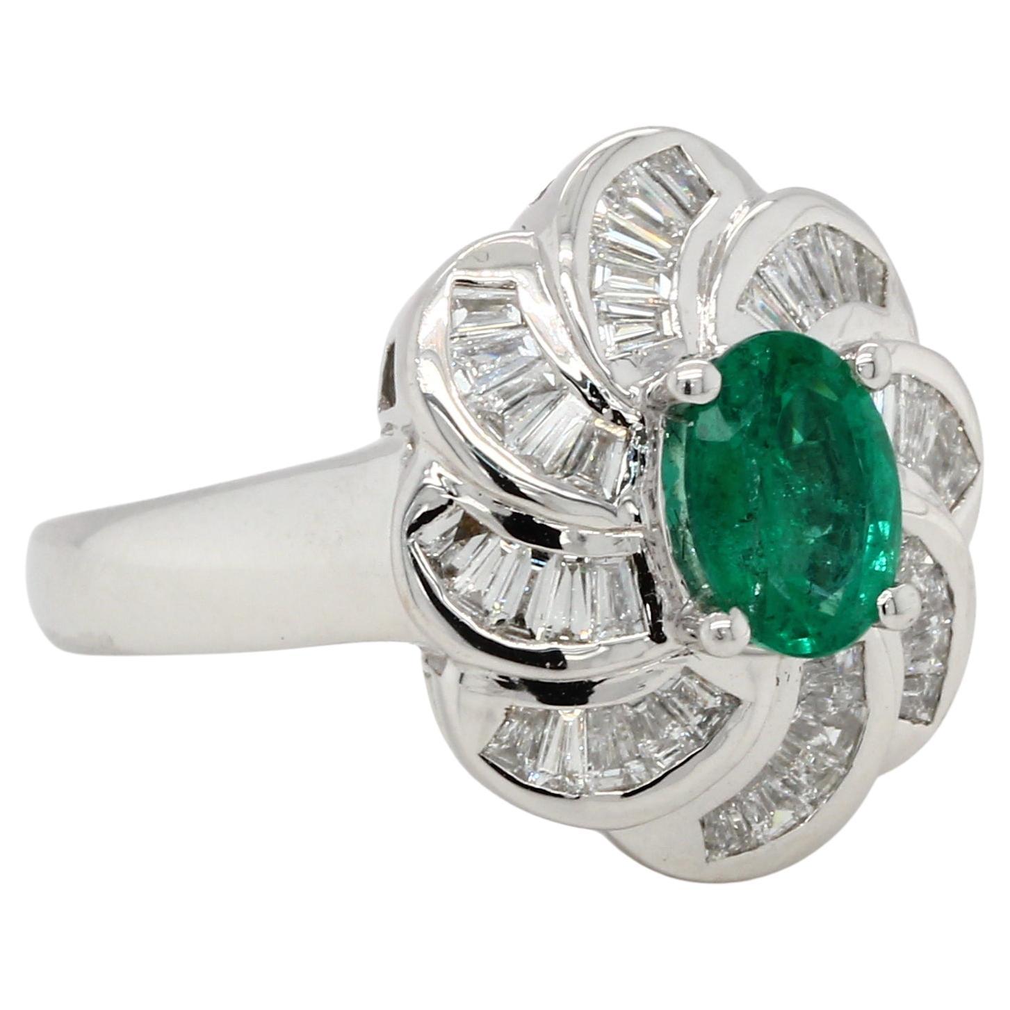 A brand new 18K gold ring with a 0.79 carat emerald and 0.52 carat diamond. This ring features a 0.79 carat emerald oval shape with a 0.52 carat diamond tapper. This ring is made of 18K white gold and weighs 8.15 grams.

Allure Jewellery Mfg. Co.,