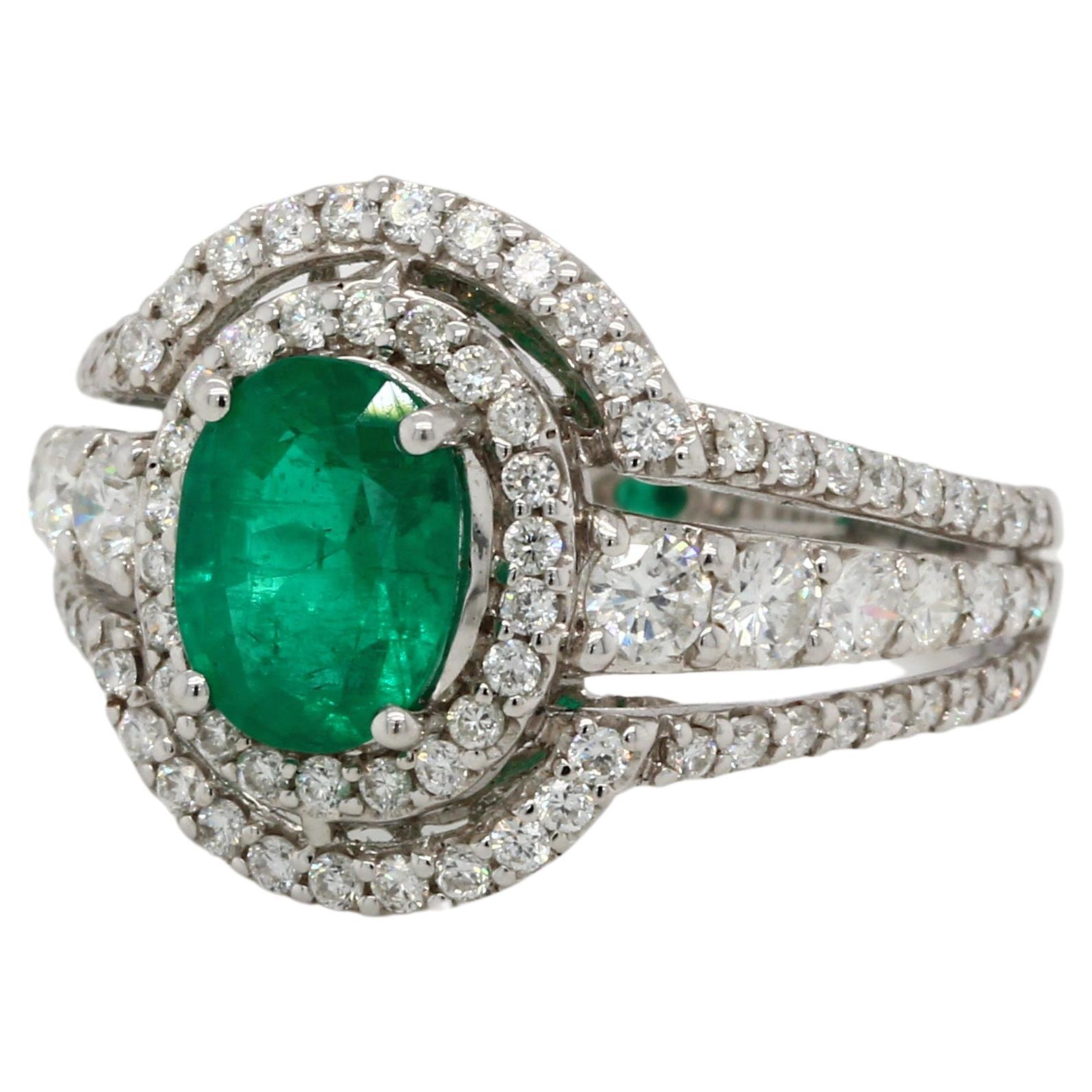 Oval Cut Emerald and Diamond Ring in 18 Karat Gold For Sale