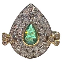 Retro Emerald and Diamond Ring in 18 Karat Gold