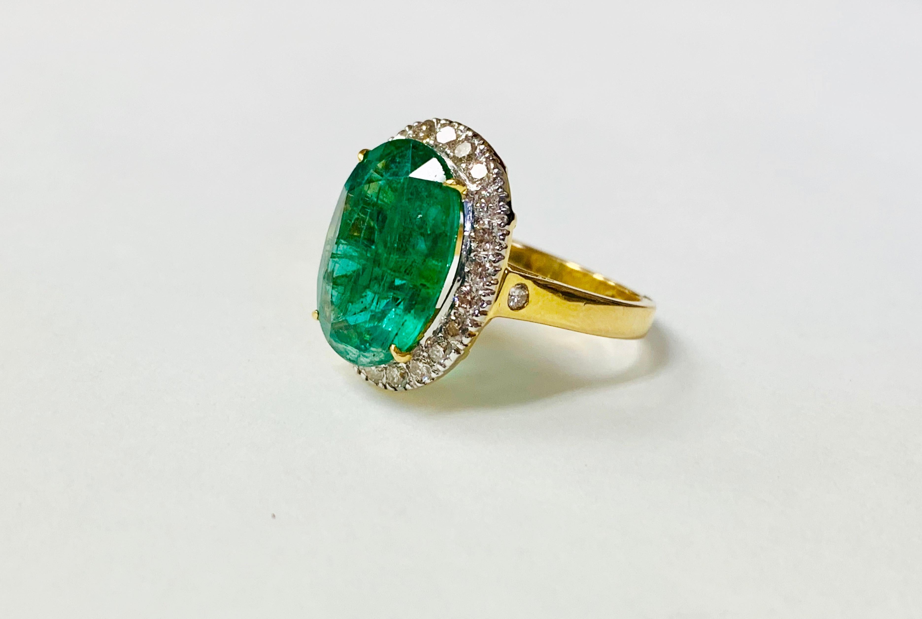 Oval Cut Emerald and Diamond Ring in 18 Karat Yellow Gold