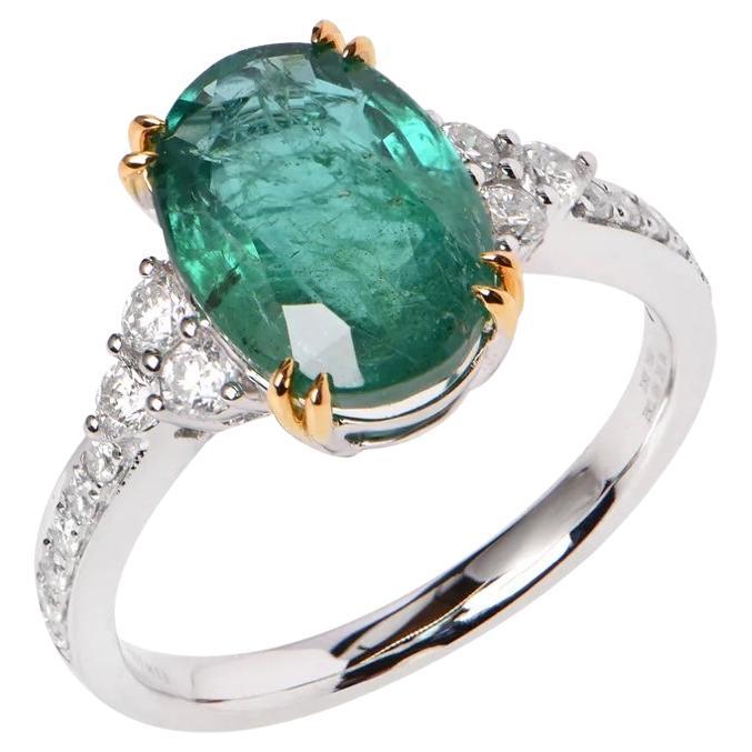 An 18ct White Gold ring featuring an Emerald (2.98ct), and 18 Diamonds totalling 0.36ct. Finger size L 1/2 (US 5 7/8).