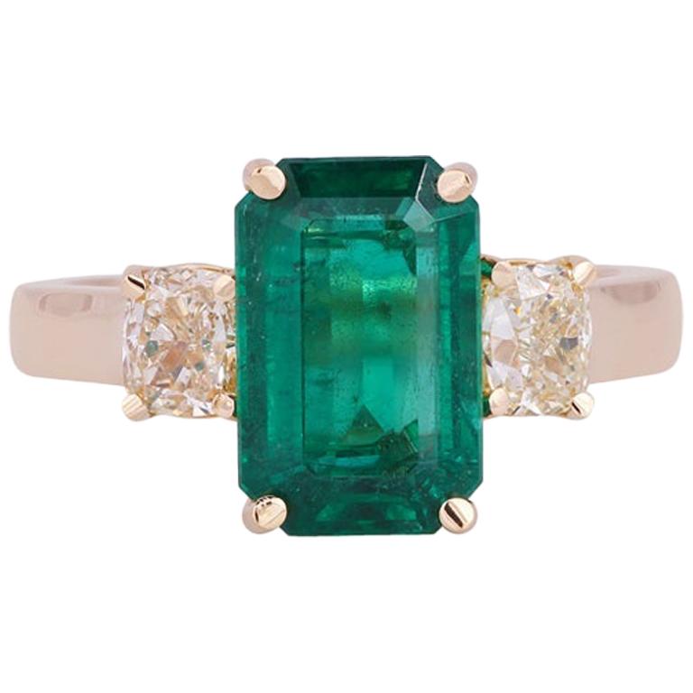 Emerald and Diamond Ring Studded in 18 Karat Yellow Gold
