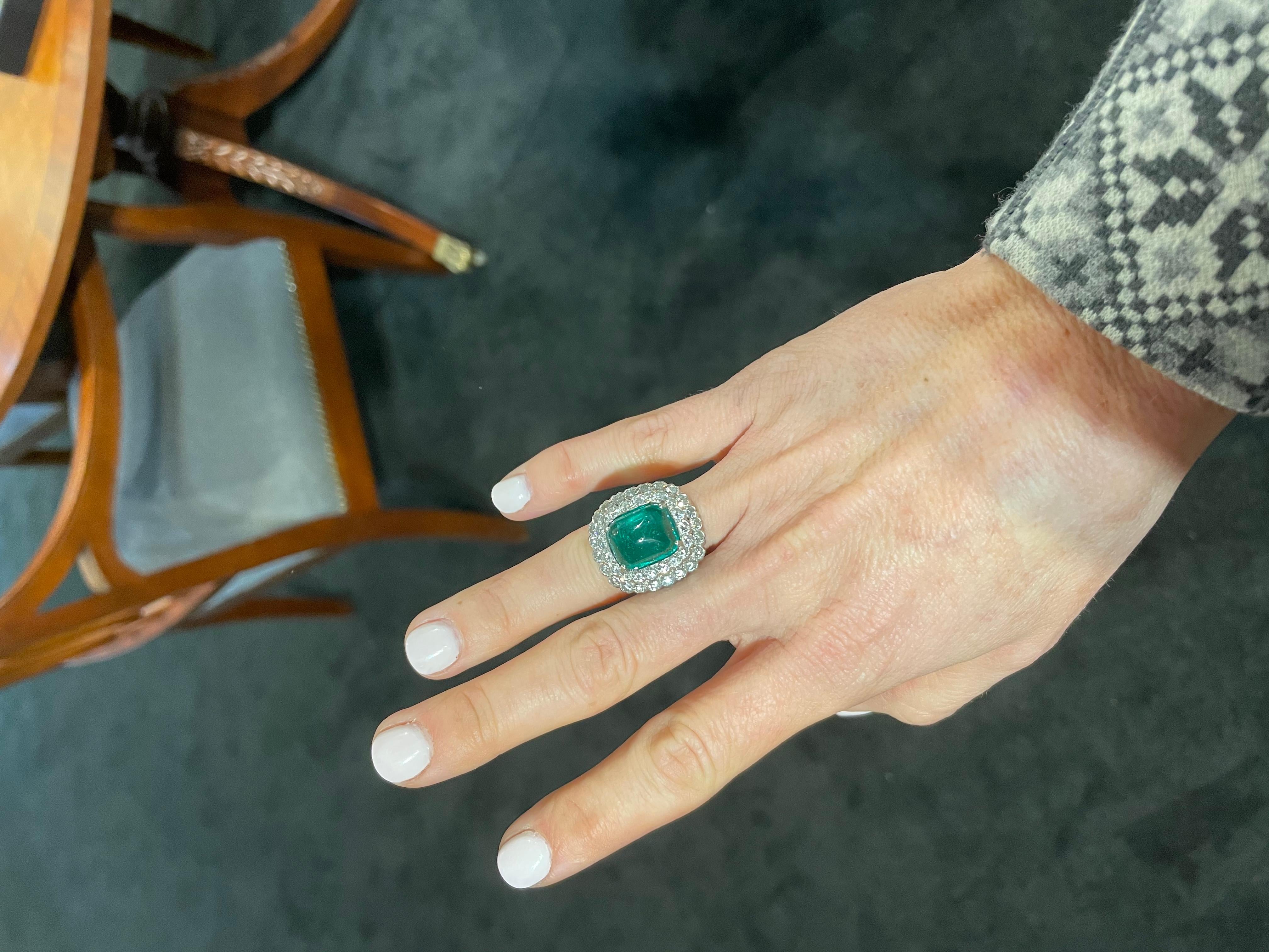 One of a kind William Ruser  7.40ct sugar-loaf Colombian emerald ring. The hand crafted platinum setting features wwiss- and round brilliant-cut diamonds with G/H color and VS clarity weighing 3.00 carats.

Accompanied by AGL Report No. 1098106,