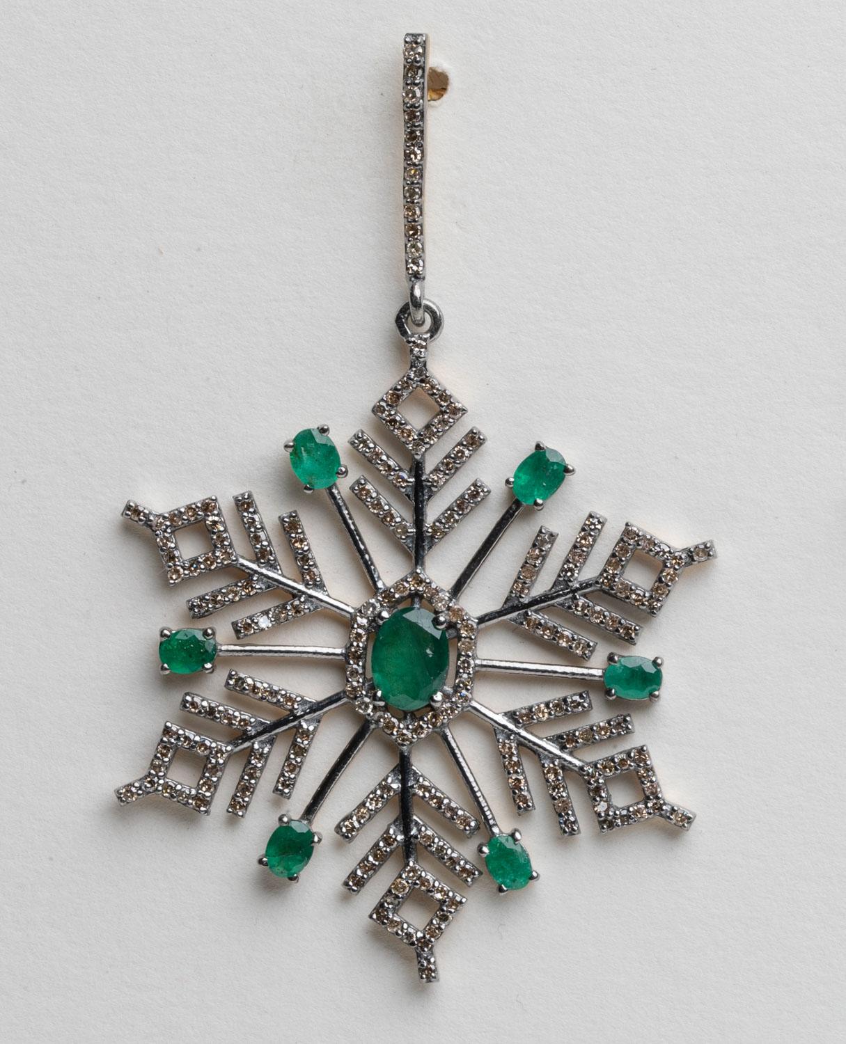 An amazing pair of snowflake motif earrings with faceted oval emeralds with round, brilliant cut diamonds in a pave` setting.  Set in an oxidized sterling silver.  18K gold post for pierced ears.  Total weight of emeralds is 3.18 carats, diamonds