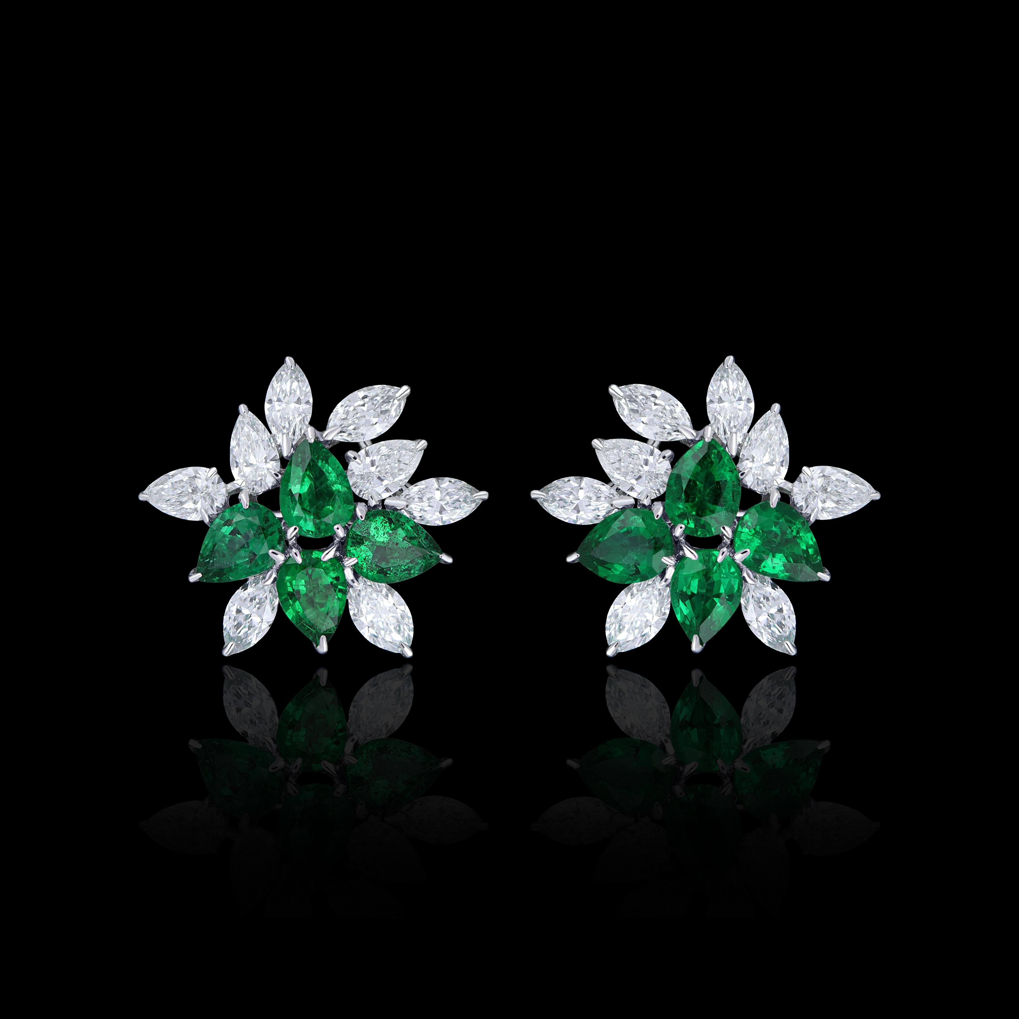 Elegant and exquisitely detailed 18 Karat White Gold Earring, center set with 0.90Cts .Pear Shape Emerald and micro pave set Diamonds, weighing approx. 0.88Cts Beautifully Hand crafted in 18 Karat White Gold.

Stone Detail:
Emerald: 4x3MM

Stone
