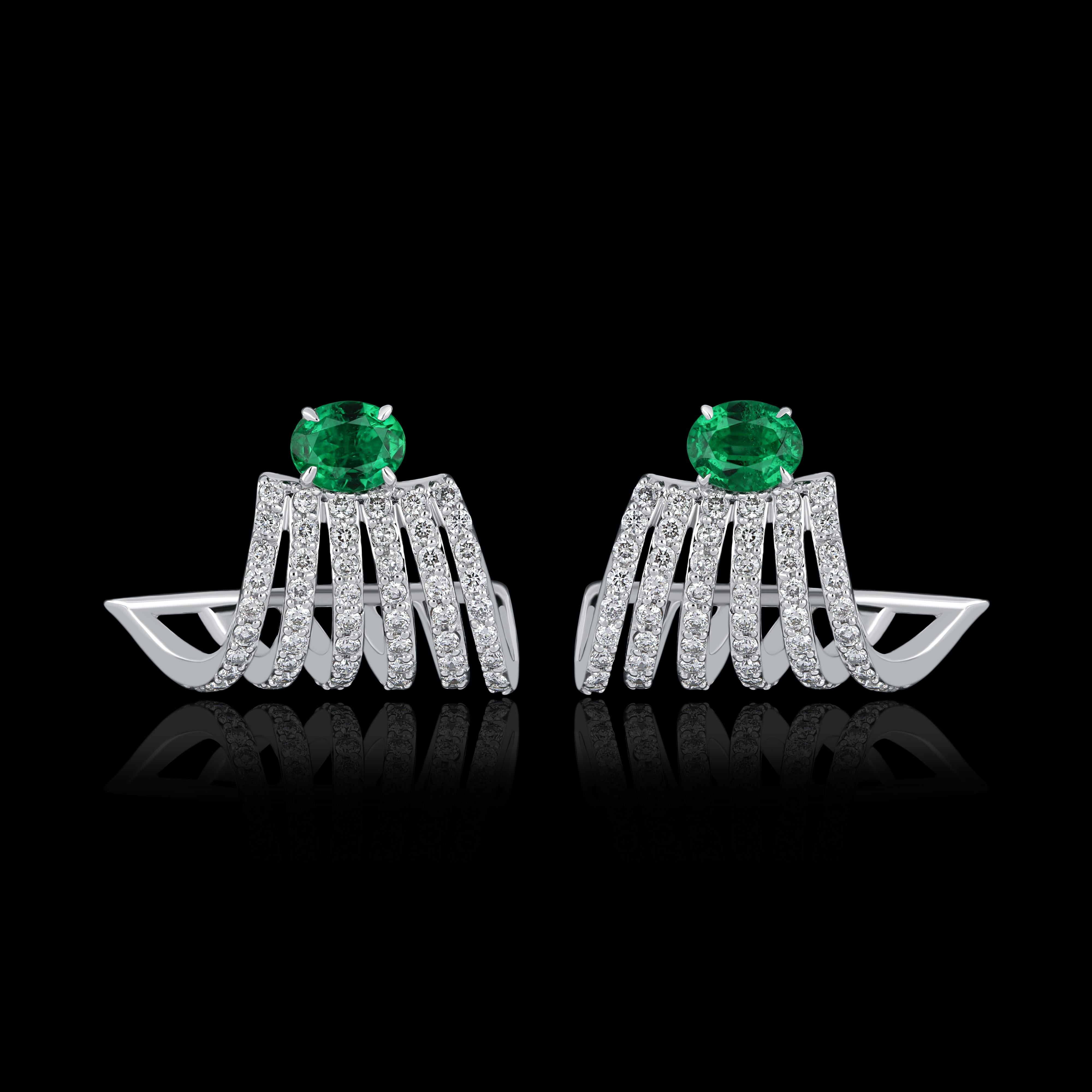 Elegant and exquisitely detailed 18 Karat White Gold Earring, center set with 0.50 Cts .Oval Shape Emerald and micro pave set Diamonds, weighing approx. 0.69 Cts Beautifully Hand crafted in 18 Karat White Gold.

Stone Detail:
Emerald: 5x4MM

Stone