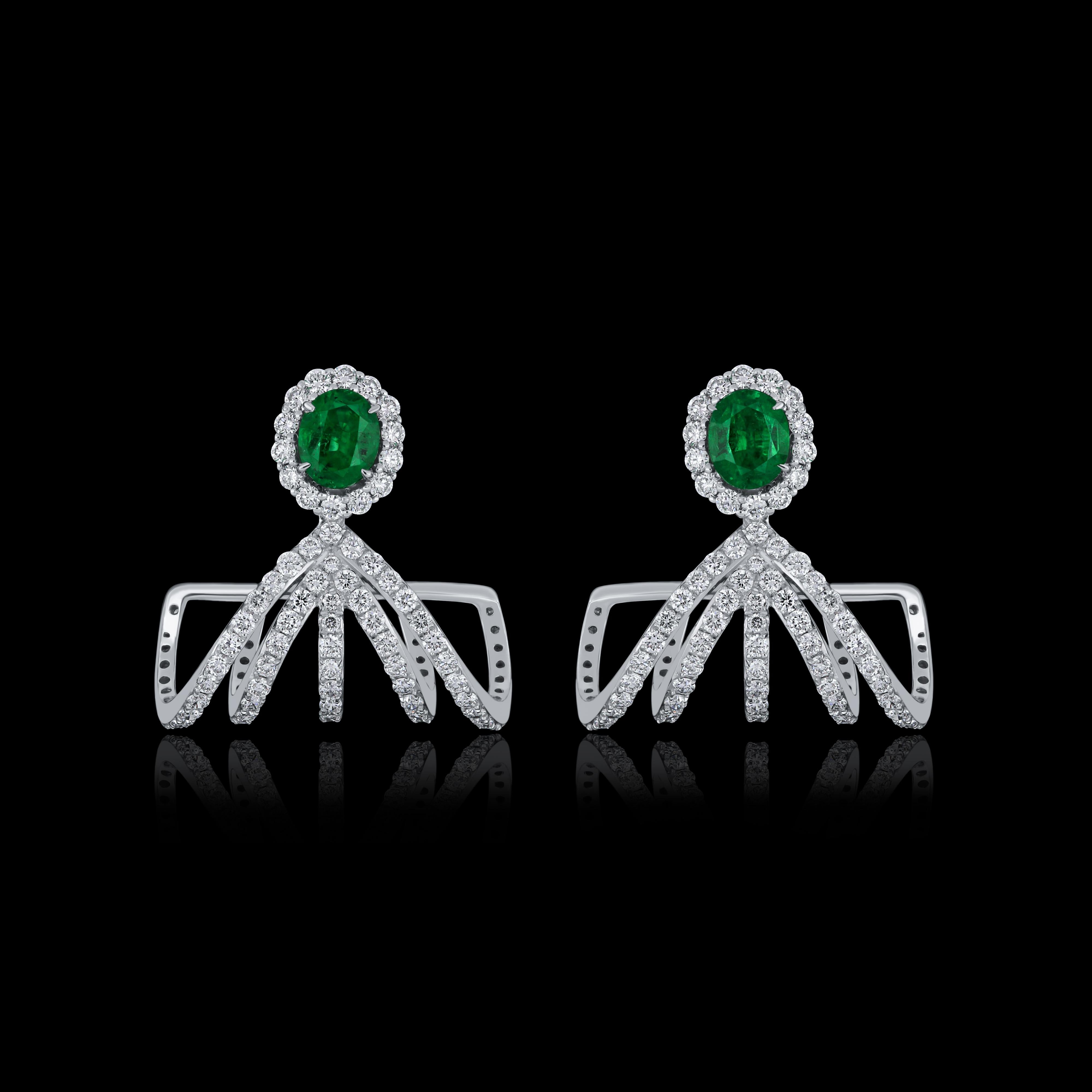 Elegant and exquisitely detailed 18 Karat White Gold Earring, center set with 0.64Cts .Oval Shape Emerald and micro pave set Diamonds, weighing approx. 1.41Cts Beautifully Hand crafted in 18 Karat White Gold.

Stone Detail:
Emerald: 5x4MM

Stone