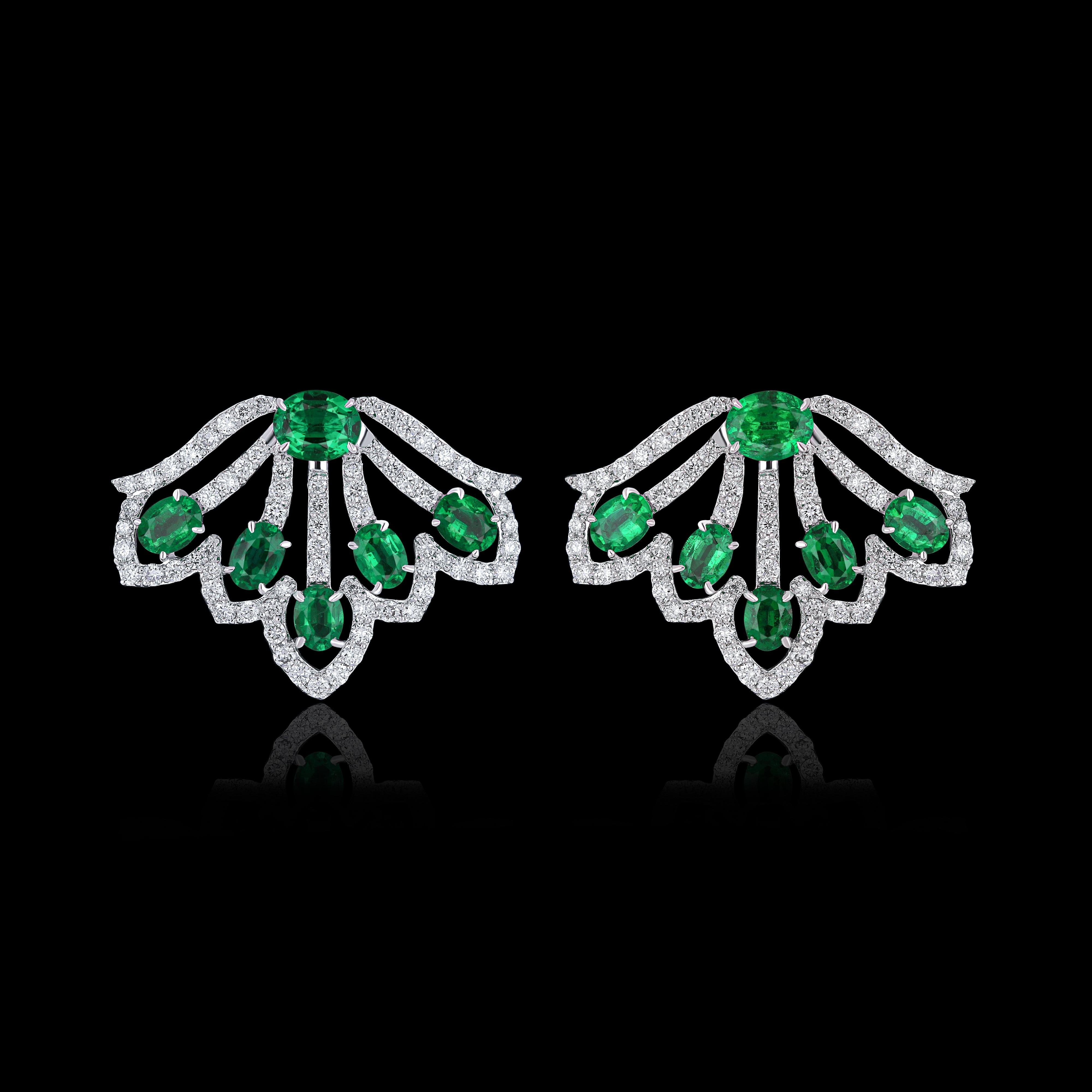Elegant and exquisitely detailed 18 Karat White Gold Earring, center set with 1.94Cts .Oval Cut Vibrant Green Emerald and micro pave set Diamonds, weighing approx. 1.07Cts Beautifully Hand crafted in 18 Karat White Gold.

Stone Detail:
Emerald: