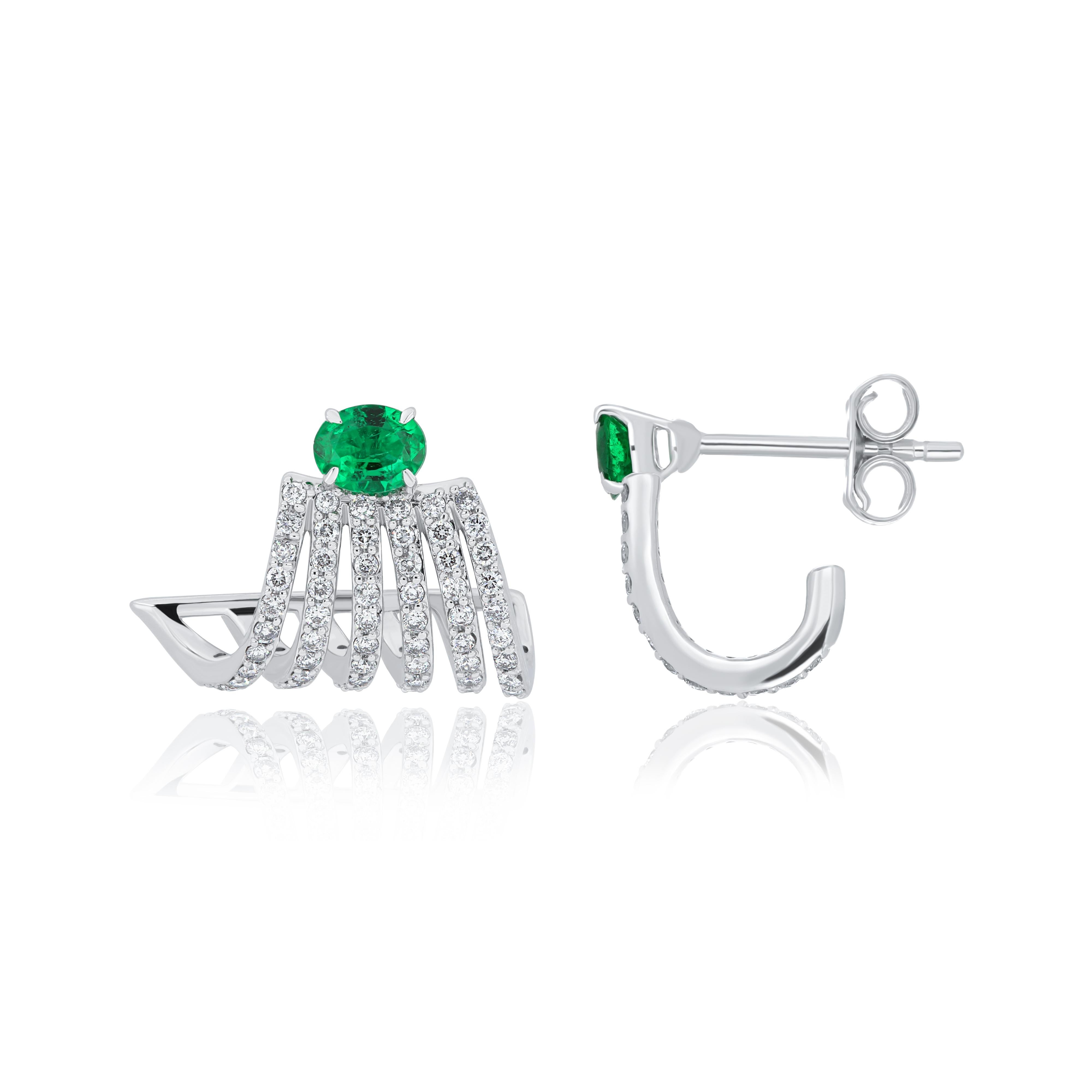 Oval Cut Emerald and Diamond Studded Earrings in 18 Karat White Gold For Sale