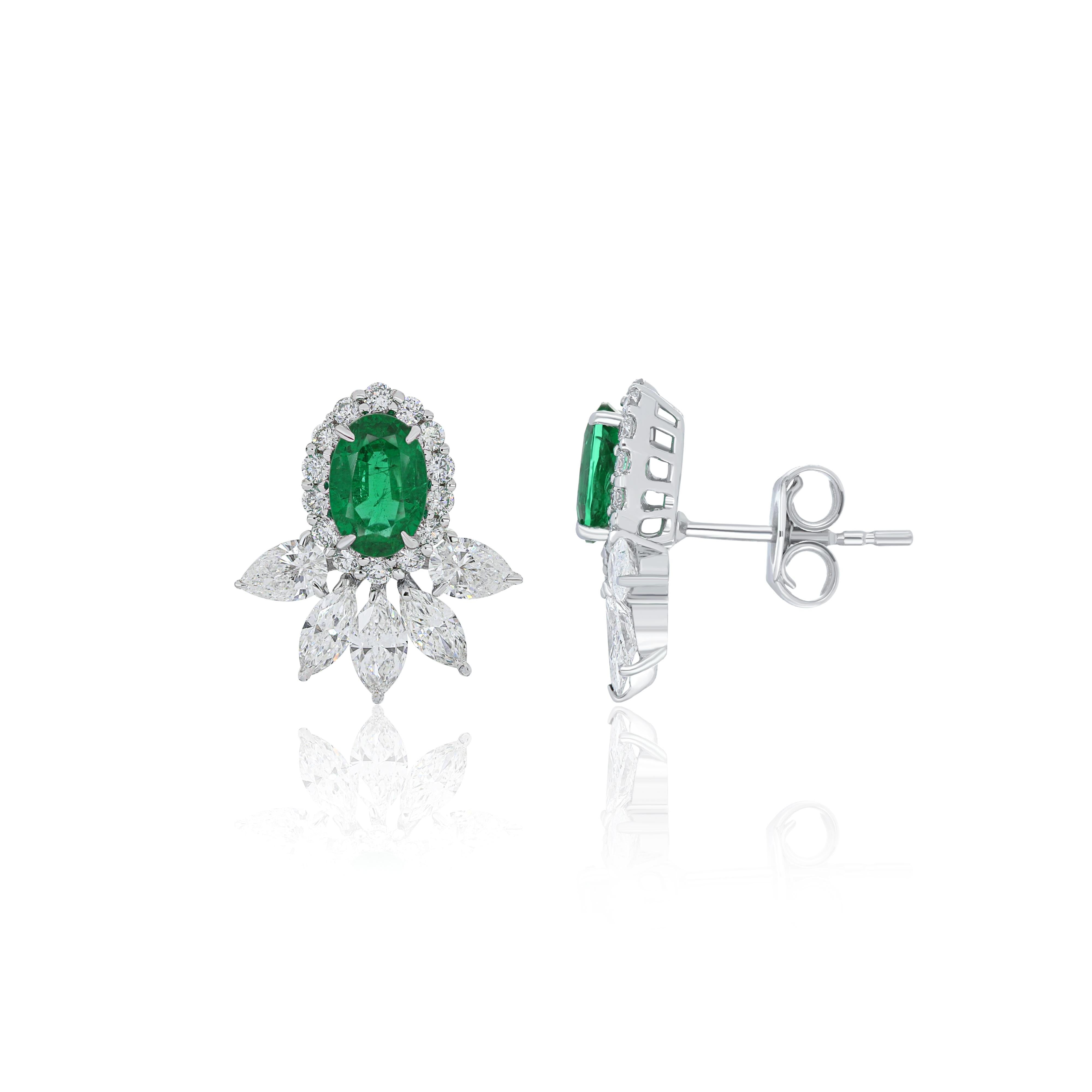 Oval Cut Emerald and Diamond Studded Earrings in 18 Karat White Gold handcraft jewelry For Sale