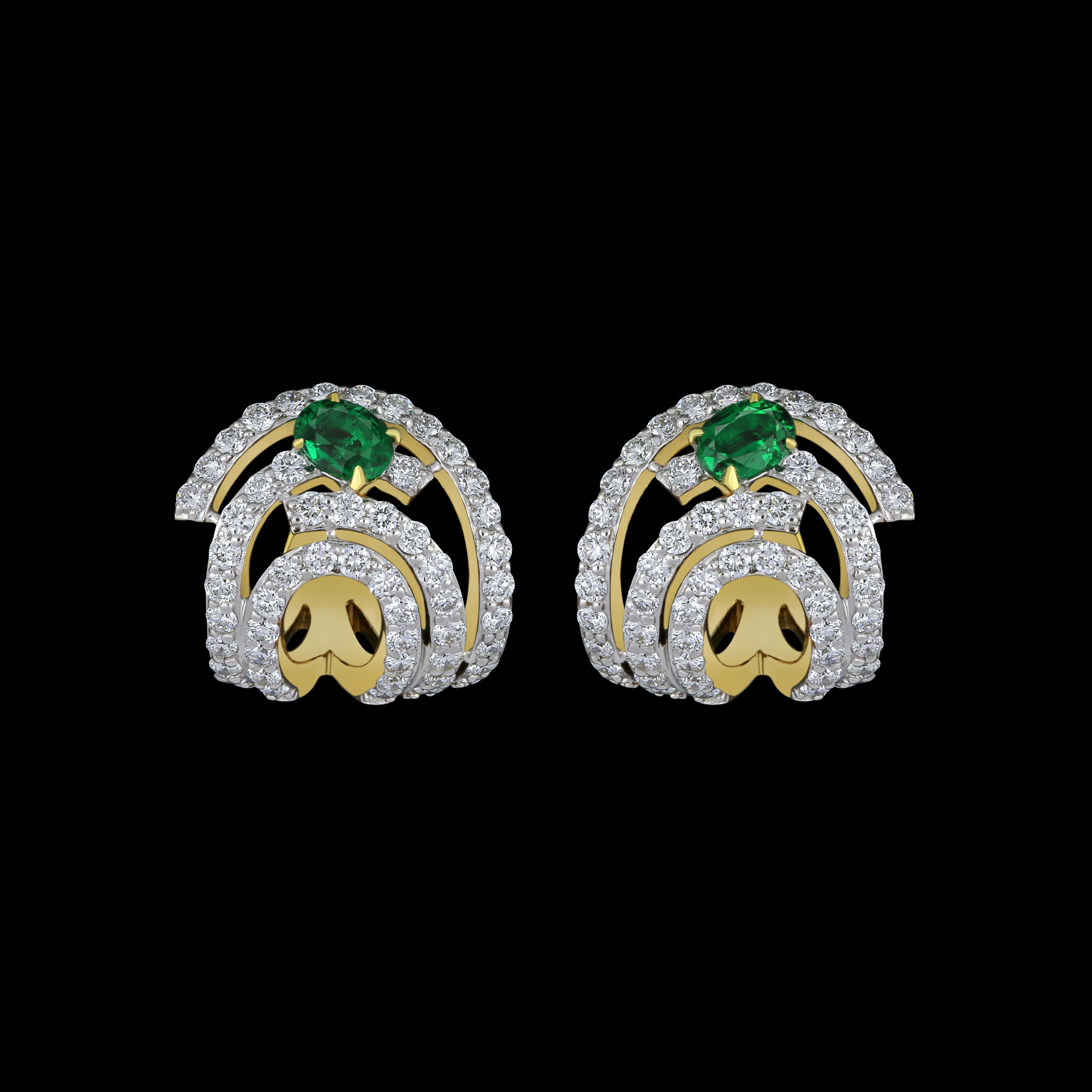 Elegant and exquisitely detailed 18 Karat White Gold Earring, center set with 0.30Cts .Oval Shape Emerald and micro pave set Diamonds, weighing approx. 0.95Cts Beautifully Hand crafted in 18 Karat White Gold.

Stone Detail:
Emerald: 4x3MM

Stone