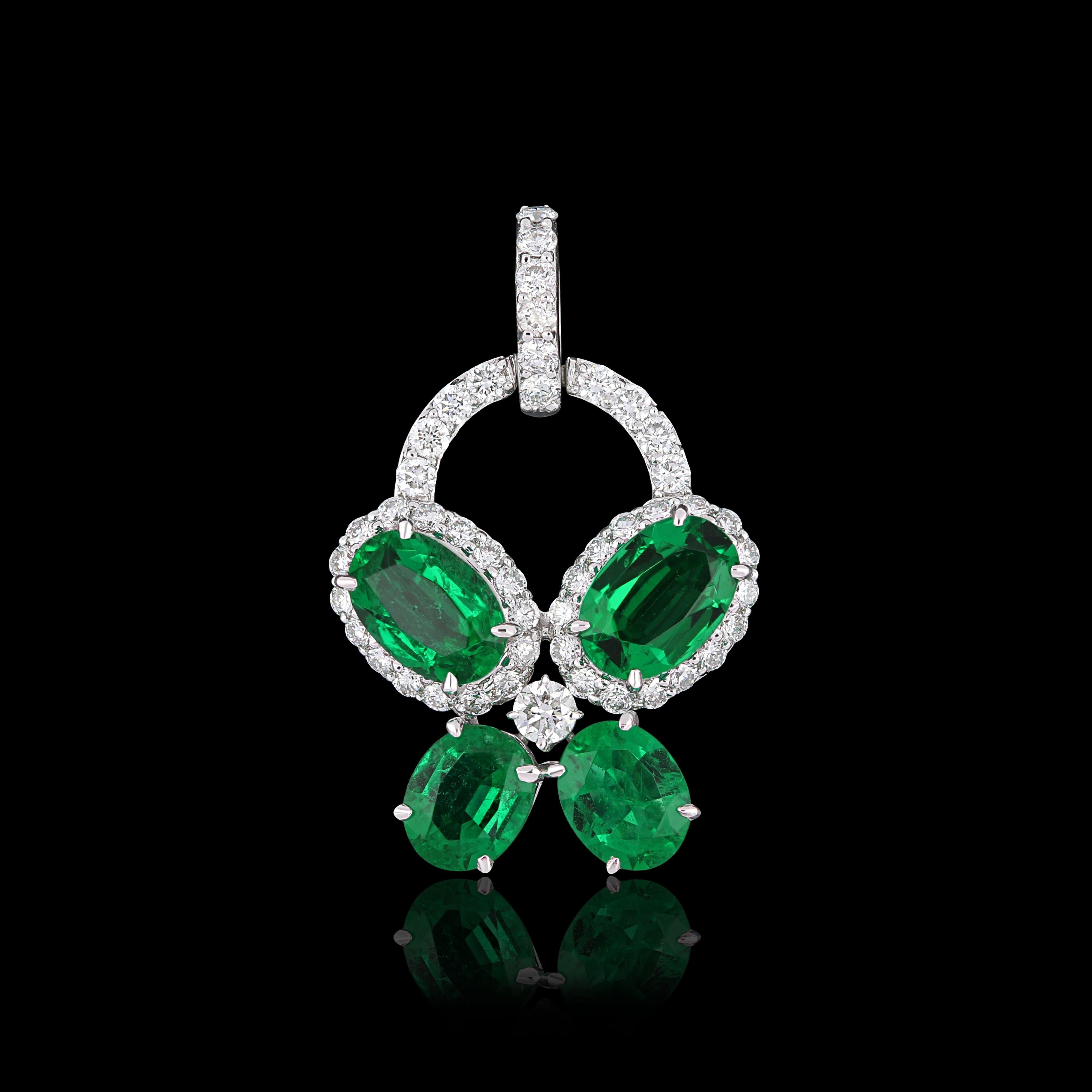 Elegant and exquisitely detailed 18 Karat White Gold Pendant, center set with 1.27 Cts .Oval Shape Emerald and micro pave set Diamonds, weighing approx. 0.36Cts Beautifully Hand crafted in 18 Karat White Gold.

Stone Detail:
Emerald: 6x4MM,