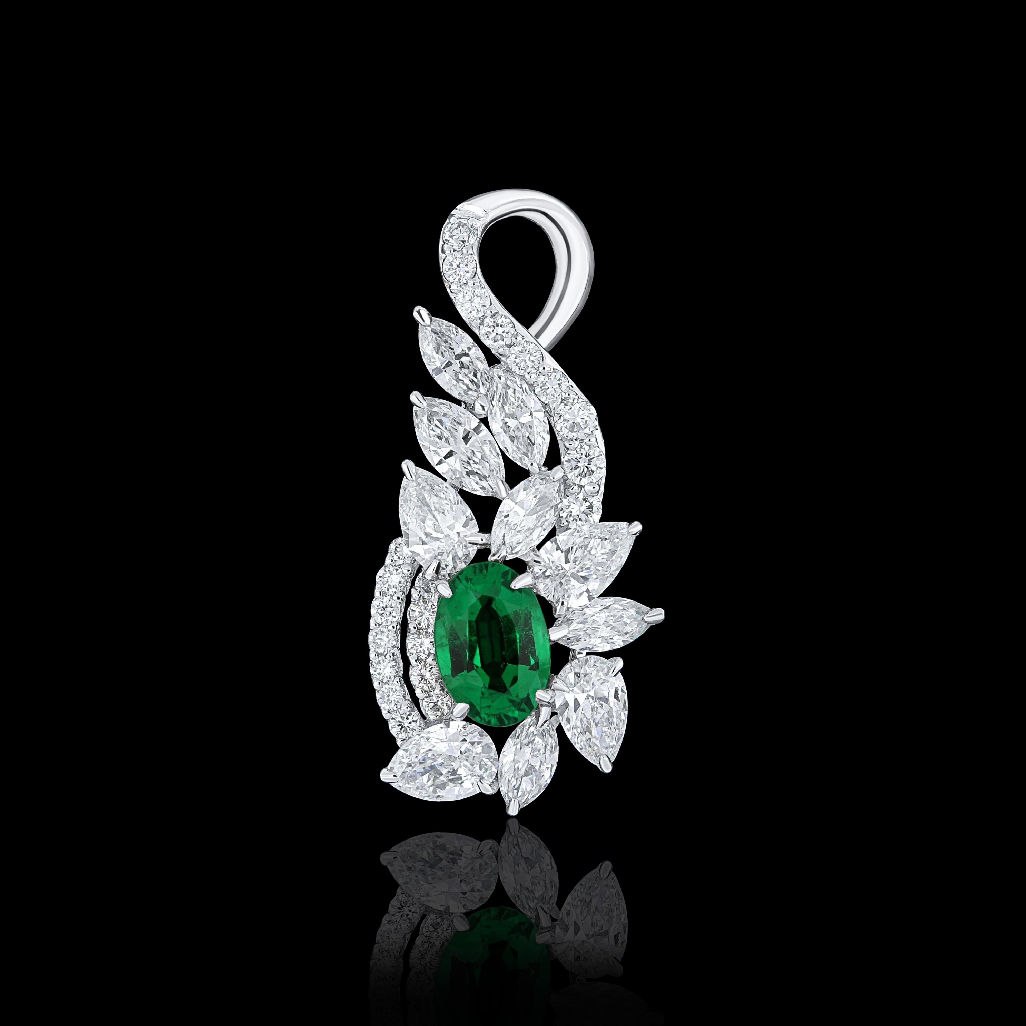 Elegant and exquisitely detailed 18 Karat White Gold Pendant, center set with 0.39Cts .Oval Shape Emerald and micro pave set Diamonds, weighing approx. 0.95Cts Beautifully Hand crafted in 18 Karat White Gold.

Stone Detail:
Emerald: 6x4MM

Stone