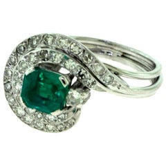 Emerald and Diamond Swirl Engagement Ring