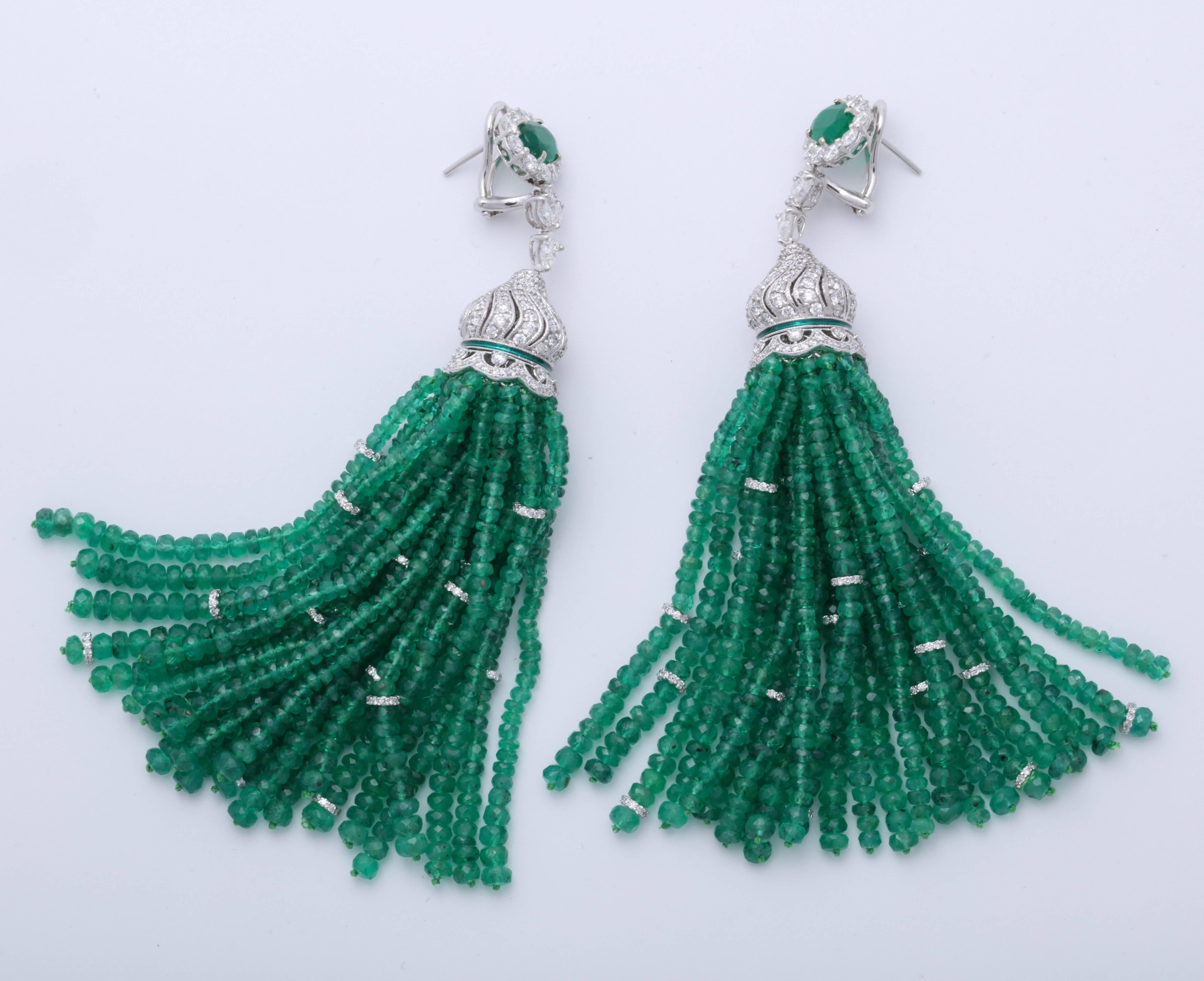 
Fabulous statement earrings! 

Over 200 carats of green emerald!    9.66 carats of diamonds!

Just over 4 inches in length 

18k white gold 

A one of a kind earring that can be worn casually or to a black tie affair. 