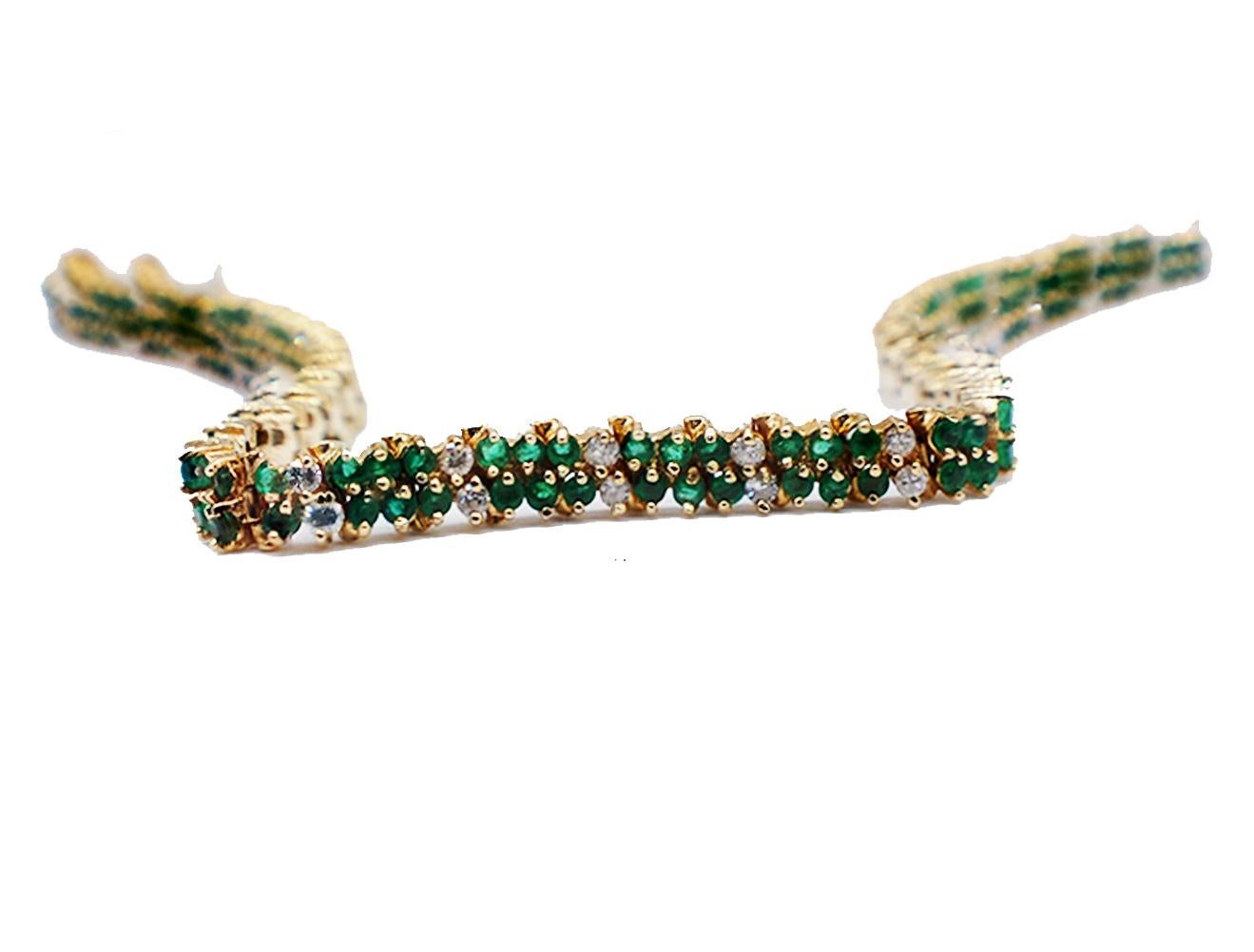 Beautiful mesh style tennis bracelet consisting emeralds and diamonds set in yellow gold.

There are 21 sets of emeralds consisting of (6) six pieces. The total weight of the 126 emeralds which measure 2 mm each weighing an estimated 3.75 carats.

