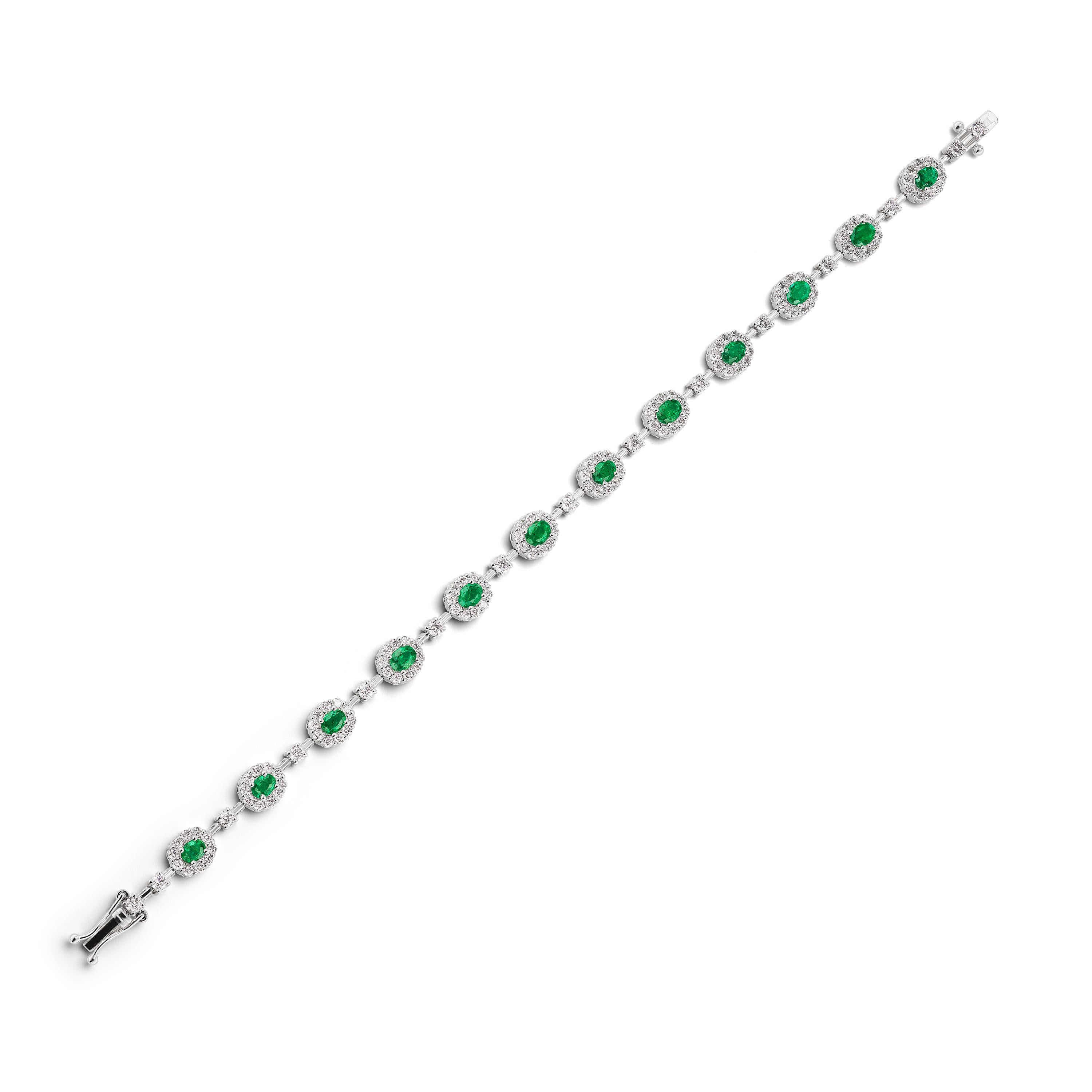 This stunning Emerald and Diamonds Tennis bracelet has a delicate air of femininity that is hard to miss. Crafted from 18K white gold, this remarkable bracelet showcases prong-set oval Emeralds sprinkled with glittering diamond accents and diamonds
