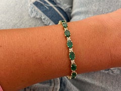 Bracciale tennis con smeraldo e diamante in oro giallo 14k