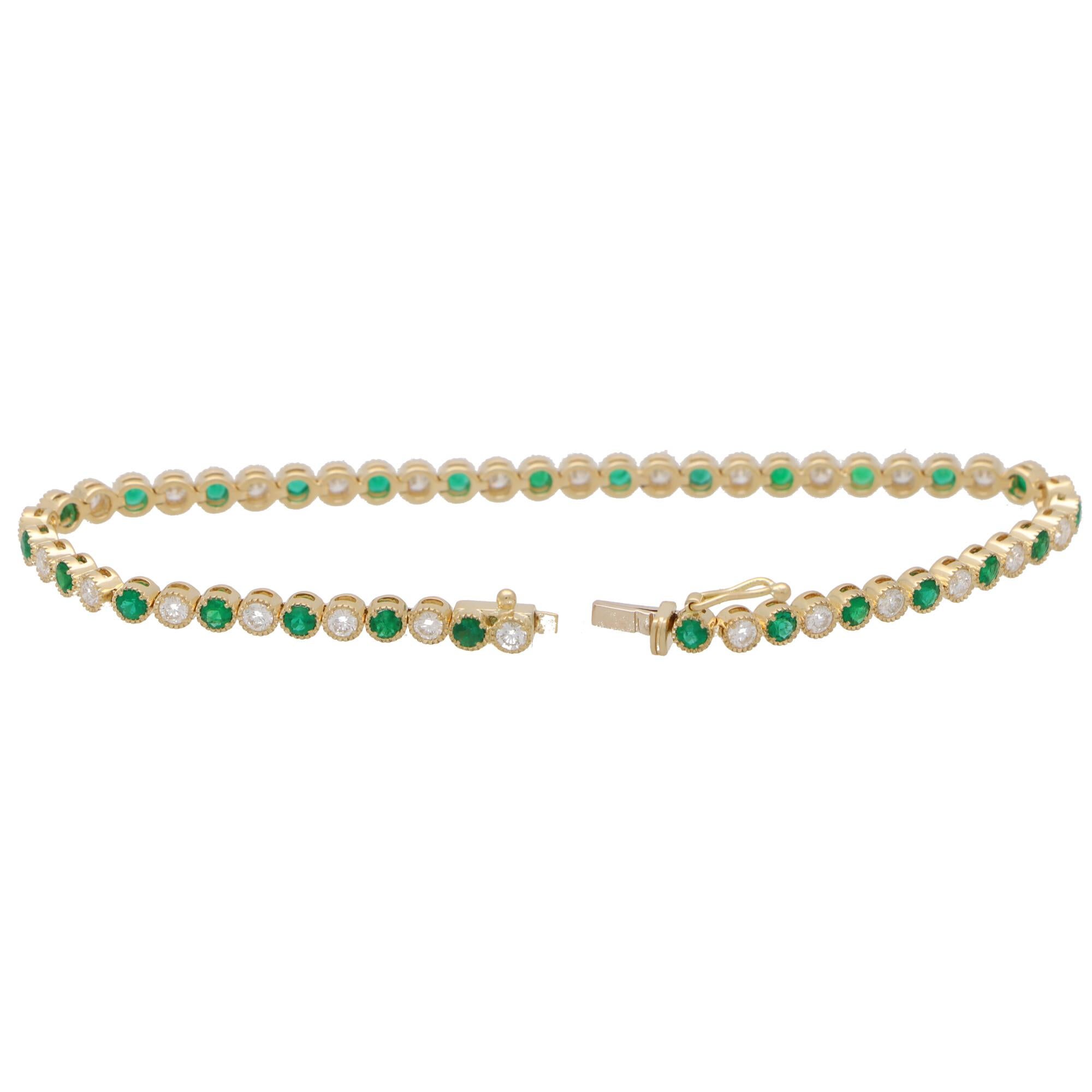 A beautiful contemporary diamond and emerald line bracelet set in 18k  yellow gold.

The bracelet is composed of a grand total of 27 round brilliant cut diamonds and 27 round cut vibrant emerald stones. All of the stones are securely bezel set in