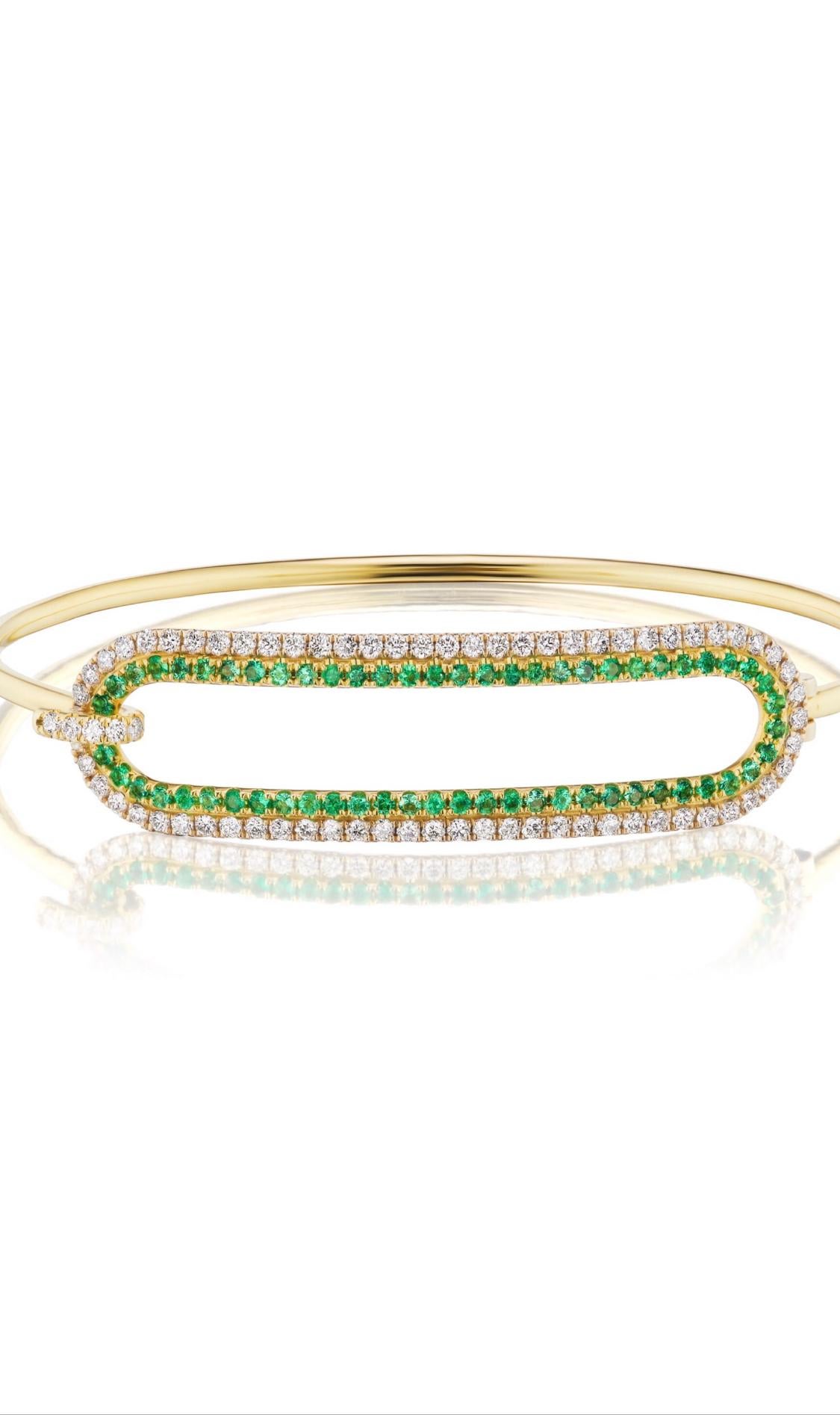 Andrew Glassford's 2mm Tension Bracelet in 18K gold with .89 carats of round Emeralds and 1.13 carats of GH VSI Diamonds that creates a stunning 