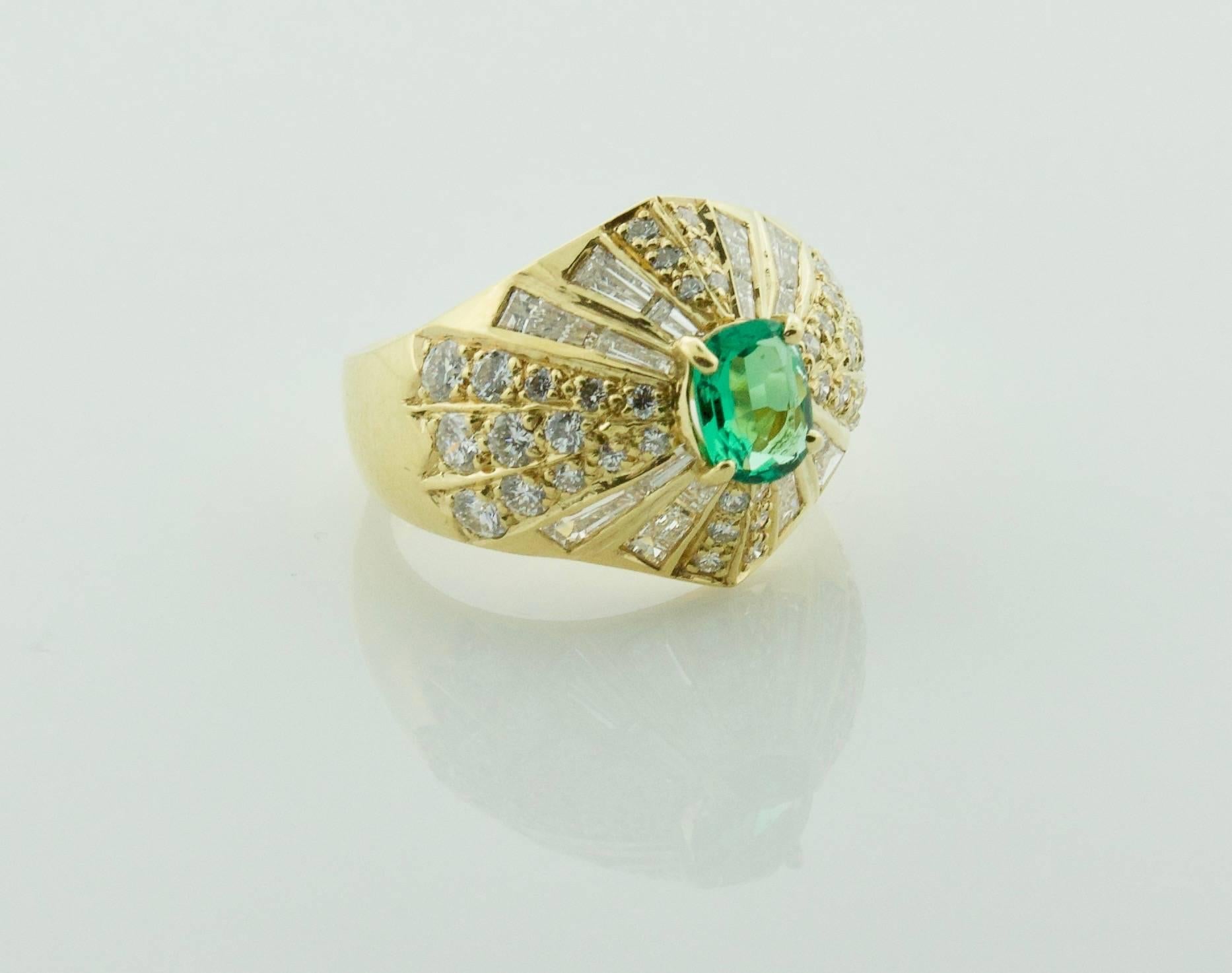 Emerald and Diamond Terrell and Zimmelman 18k Yellow Gold Ring
Designed by Bill Bates
One Bright and Brilliant Green Emerald weighing .55 carats
Sixteen Round Brilliant and Tapered Baguette  Cut Diamonds weighing 2.01 carats GH VVS-SI1
Stamped T-Z
