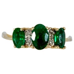 Emerald and Diamond Three-Stone Ring 14 Karat Yellow Gold