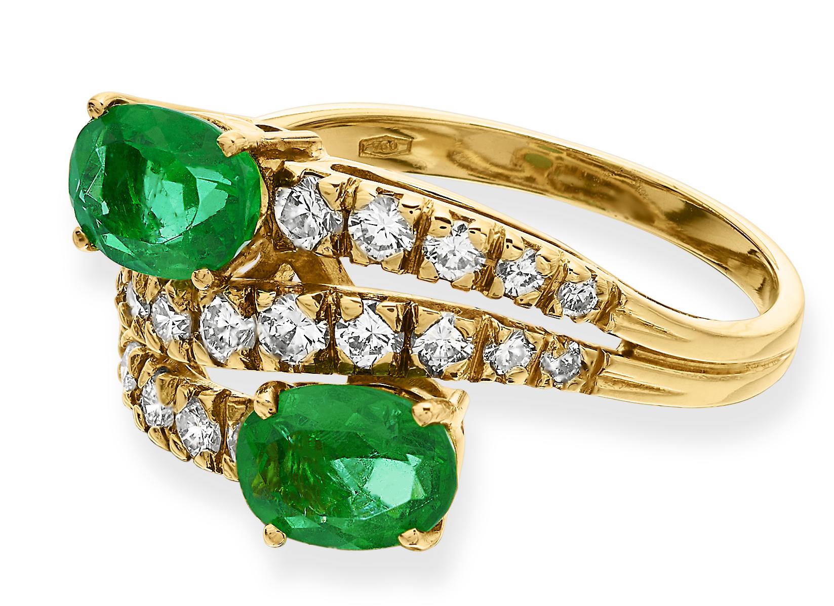 Gorgeous emerald and diamond three tiered ring in 18K yellow gold. Each and every of shade of greens, yellows and whites harmonise peacefully with each other giving  an ambience of nature. 

2 x oval shape emeralds, approximate total weight 1.40
