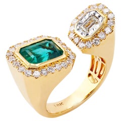 Bague à deux pierres en émeraude et diamant