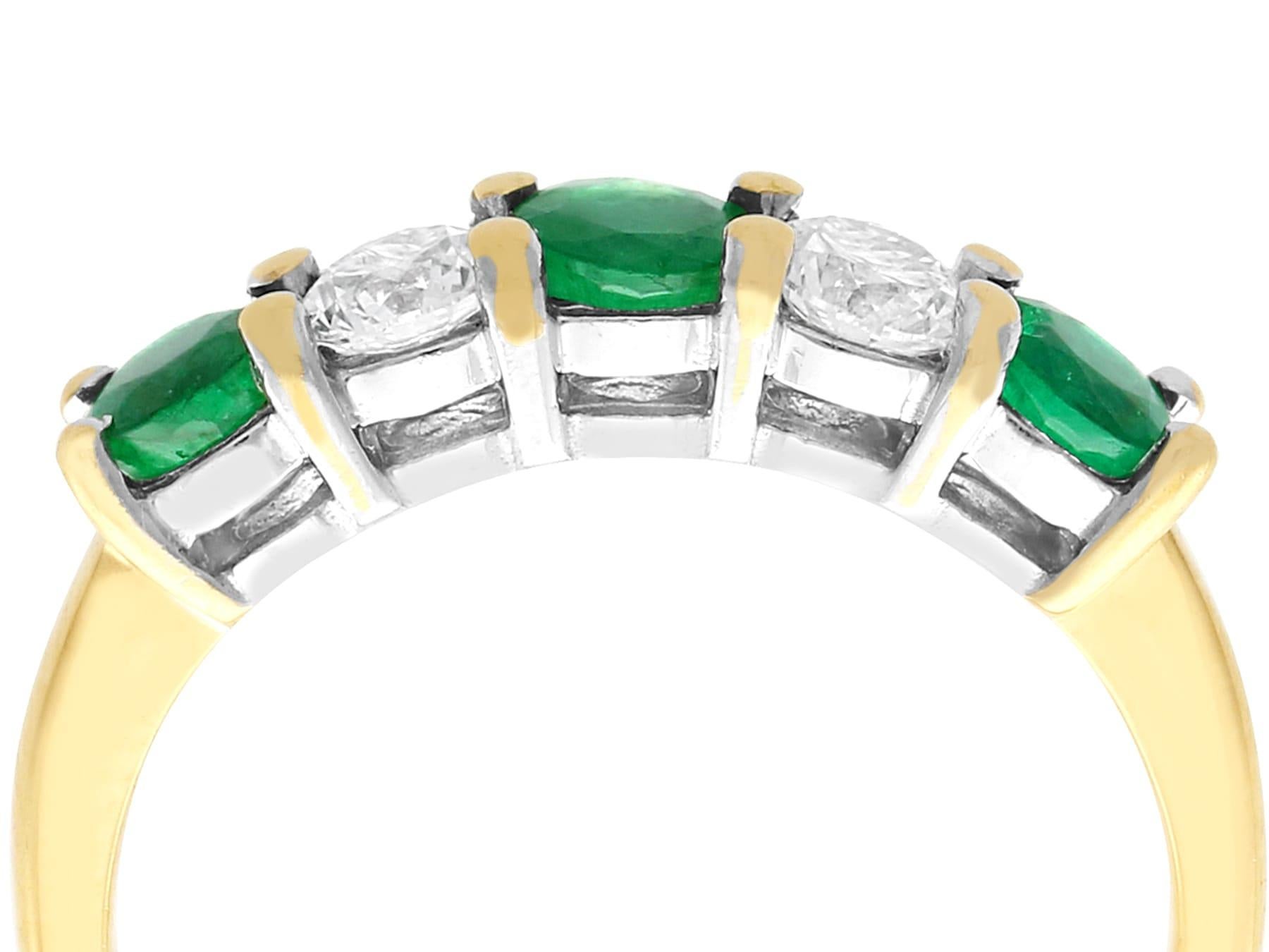 An impressive contemporary 0.72 carat emerald and 0.48 carat diamond, 18 karat yellow and white gold dress ring; part of our diverse vintage jewelry and estate jewelry collections.

This fine and impressive emerald and diamond ring has been crafted