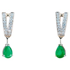 Emerald and diamonds 14k gold earrings. 