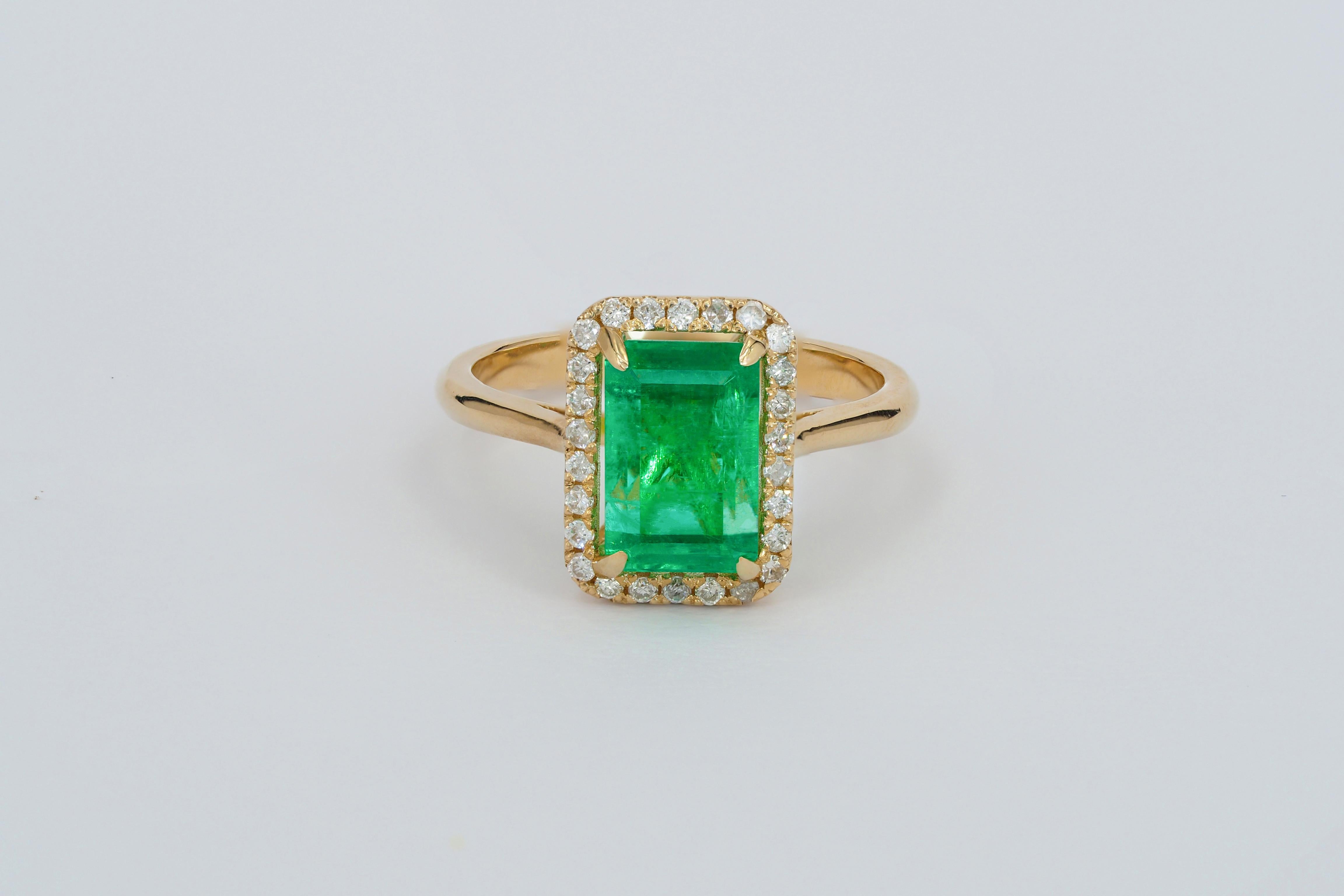 14 kt solid gold ring with emerald and diamonds. May birthstone ring.
 
14k solid gold
Weight: 3.5 g. depends from size

Central stone: Natural emerald
Emerald cut, weight - 1 ct
Clarity: Transparent with inclusions, color -  green.
 
Surrounding