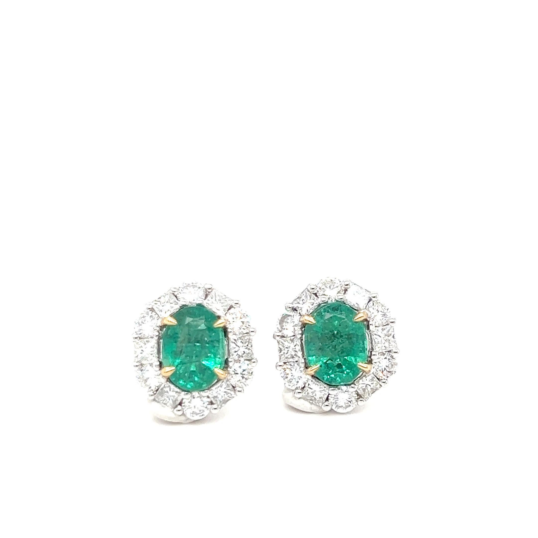 
Discover the elegance of these stunning oval-cut emerald earrings, beautifully crafted in 18K two-tone gold. The vibrant emeralds are securely set in yellow gold with four prongs, each framed by a halo of sparkling E-color diamonds with VS1