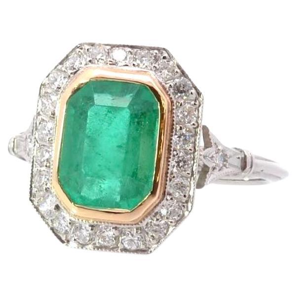 Emerald and diamonds ring in 18k gold and platine