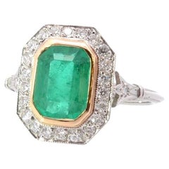 Ring aus 18 Karat Gold und Platin mit Smaragd und Diamanten