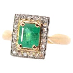 Emerald and diamonds roses ring in 18k gold and platinum