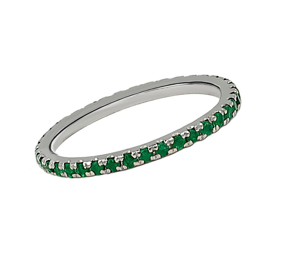 A dainty emerald band that contains approximately 0.90 carats of emeralds. This chic ring can be worn single or stacked with the same or multiple colors for a fun accessory! The material of this ring is 18K gold.
