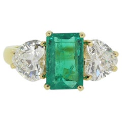 Emerald and Heart-Shaped Diamond Three-Stone Ring
