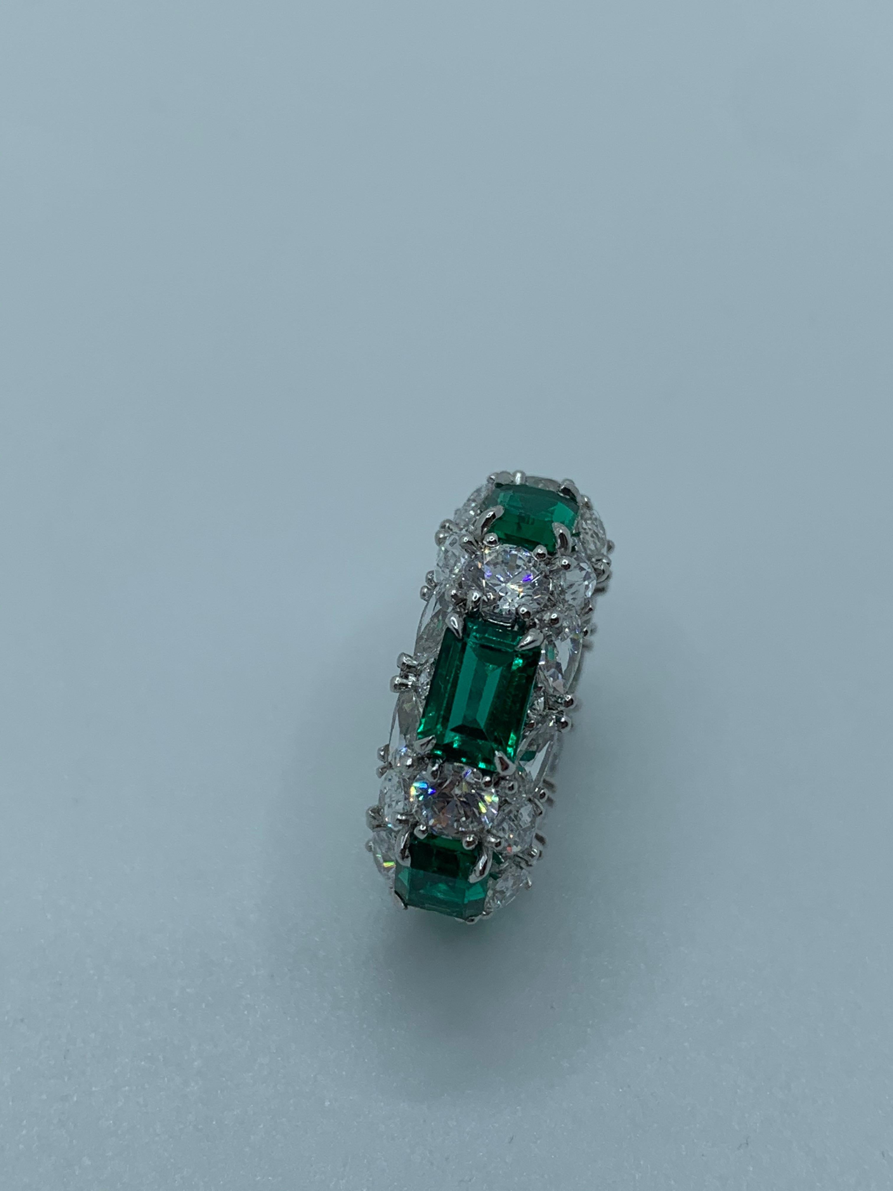 Designed as a 3 Row Bombay Shaped Ring, where you can see the different shaped stones from all angles. The Ring's main centerpiece is in the 6 fine Emeralds, each spaced out with 1 Round Diamond to highlight each Emeralds individual and intense