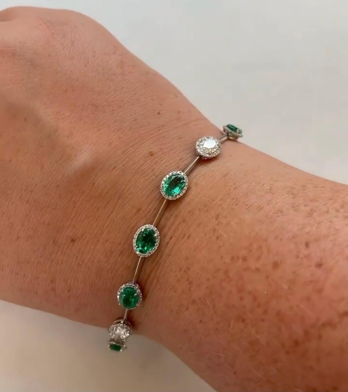 Abstract and Sophisticated Emerald and Diamond Bracelet.

8 Oval Emeralds weighing 6.30 Carats.
2 Oval Diamonds weighing 1.25 Carats.
190 Round Diamonds weighing 0.95 Carats.

Set in Platinum.