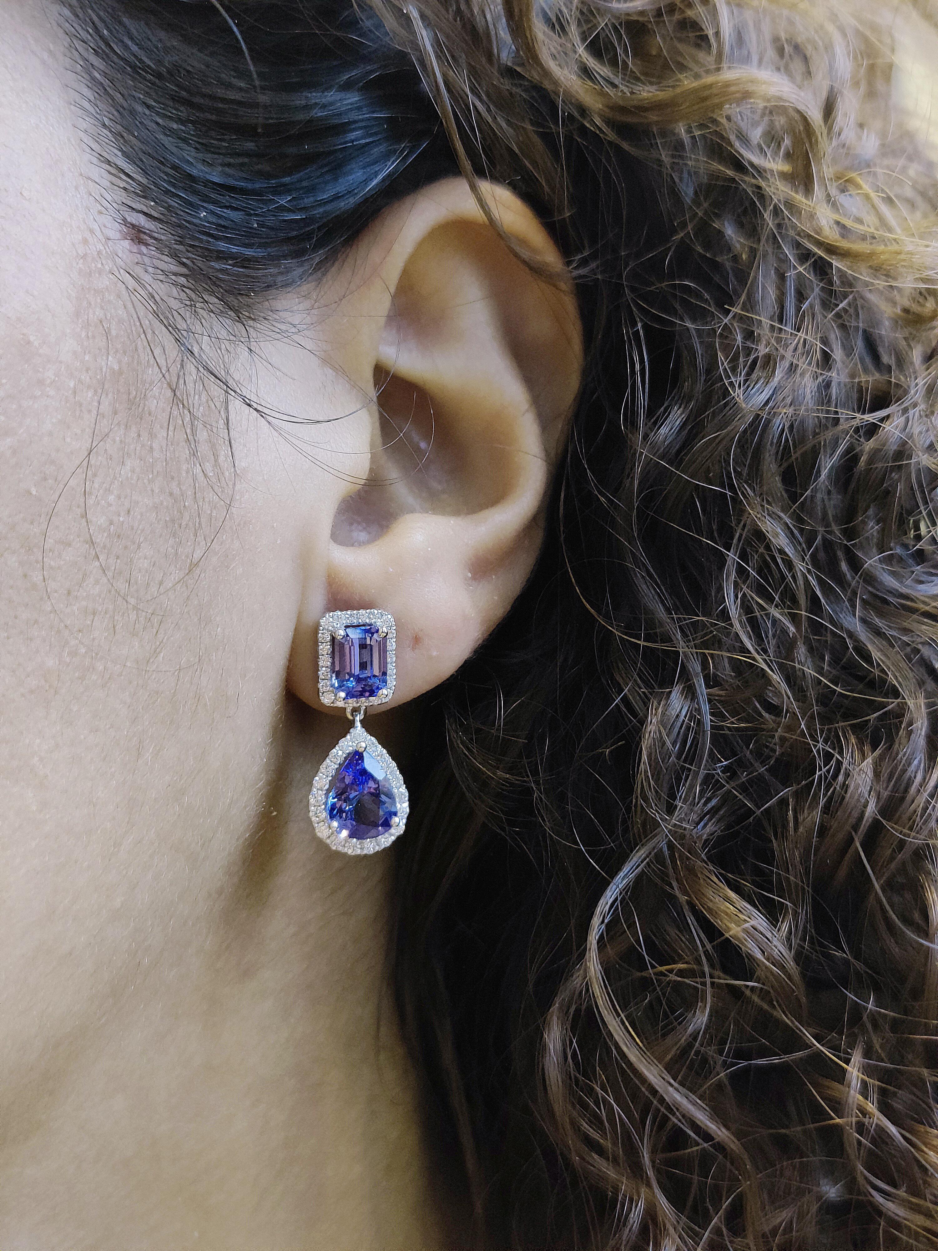 Cool tanzanite, bright gold and fiery diamonds—the epitome of elegance, this drop earring is a timeless addition to any fine-jewelry collection.

These earrings are made in 18 karat white gold. The 4 violet blue tanzanites have a total of 6.05